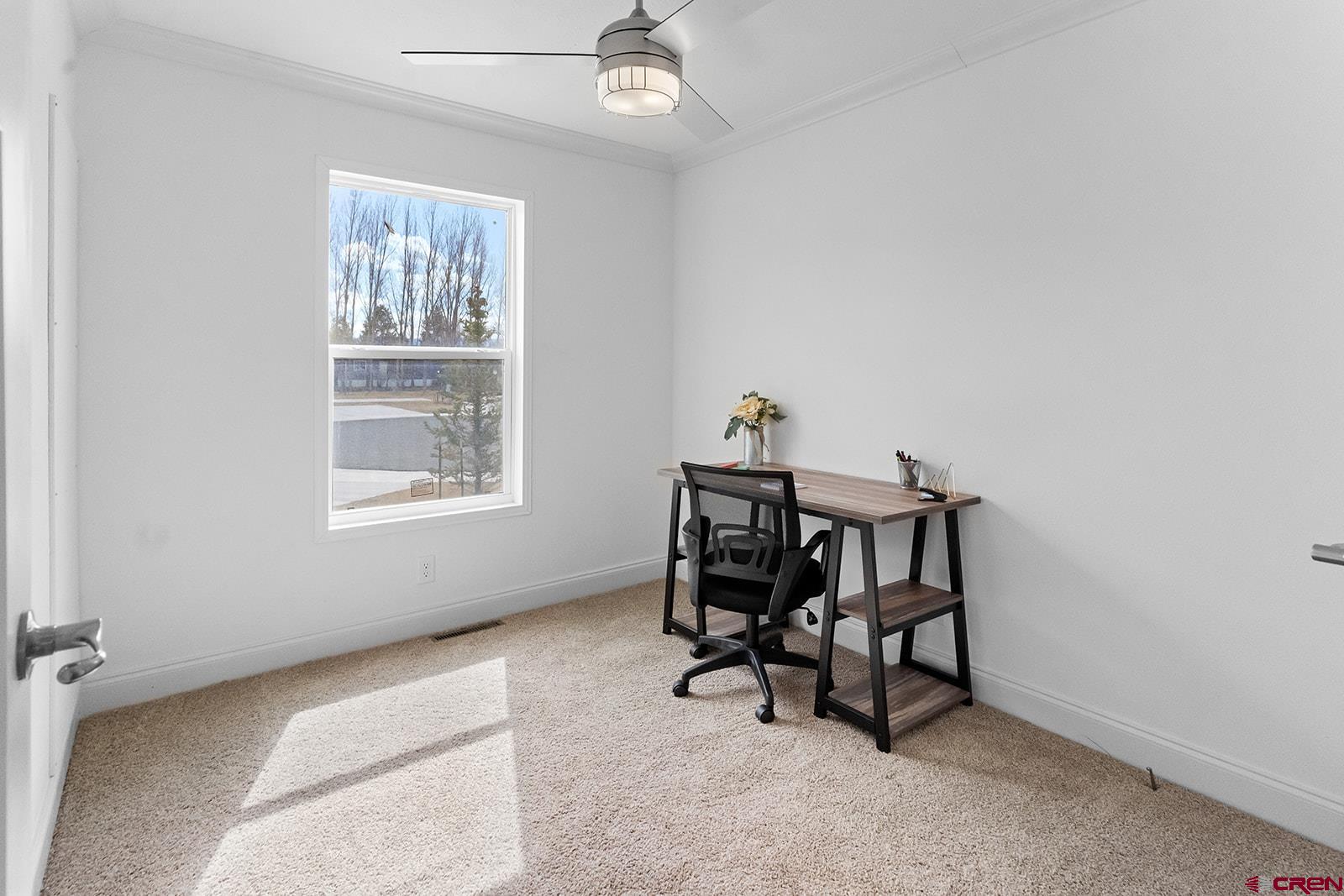 901 6530 Road, Unit 1504 Montrose, CO 81401 - Photo 13 of 25 a view of a workspace with furniture and a window