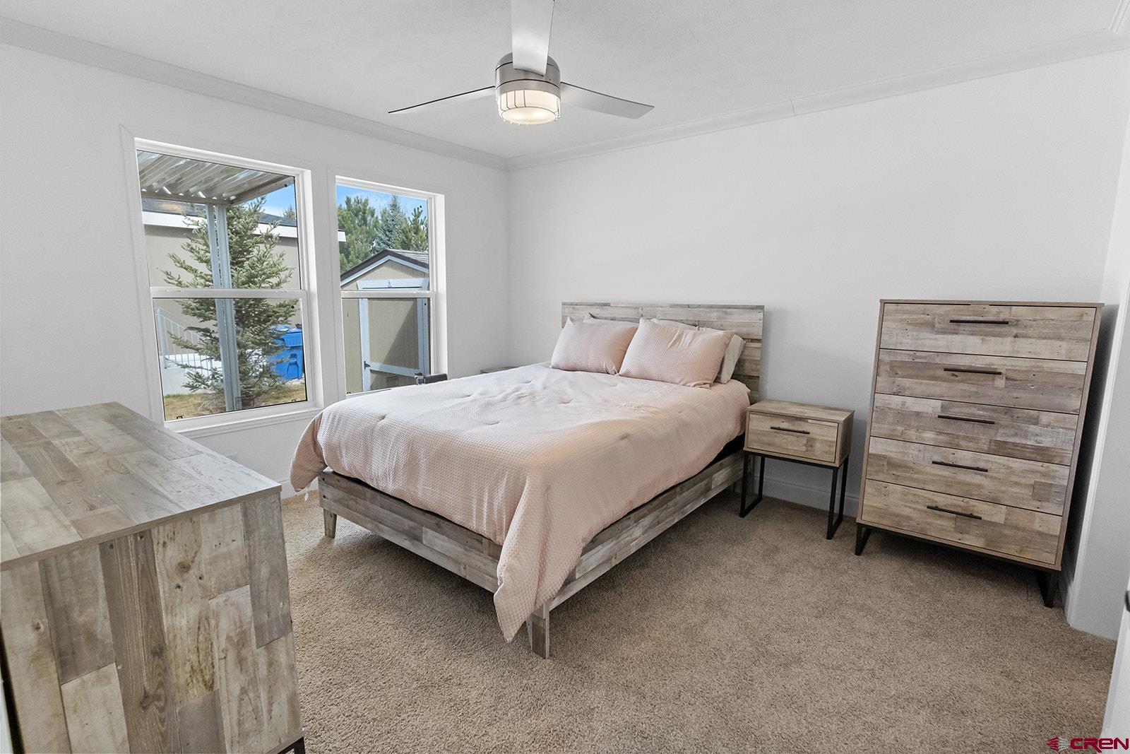 901 6530 Road, Unit 1504 Montrose, CO 81401 - Photo 16 of 25 a bedroom with a bed and a dresser