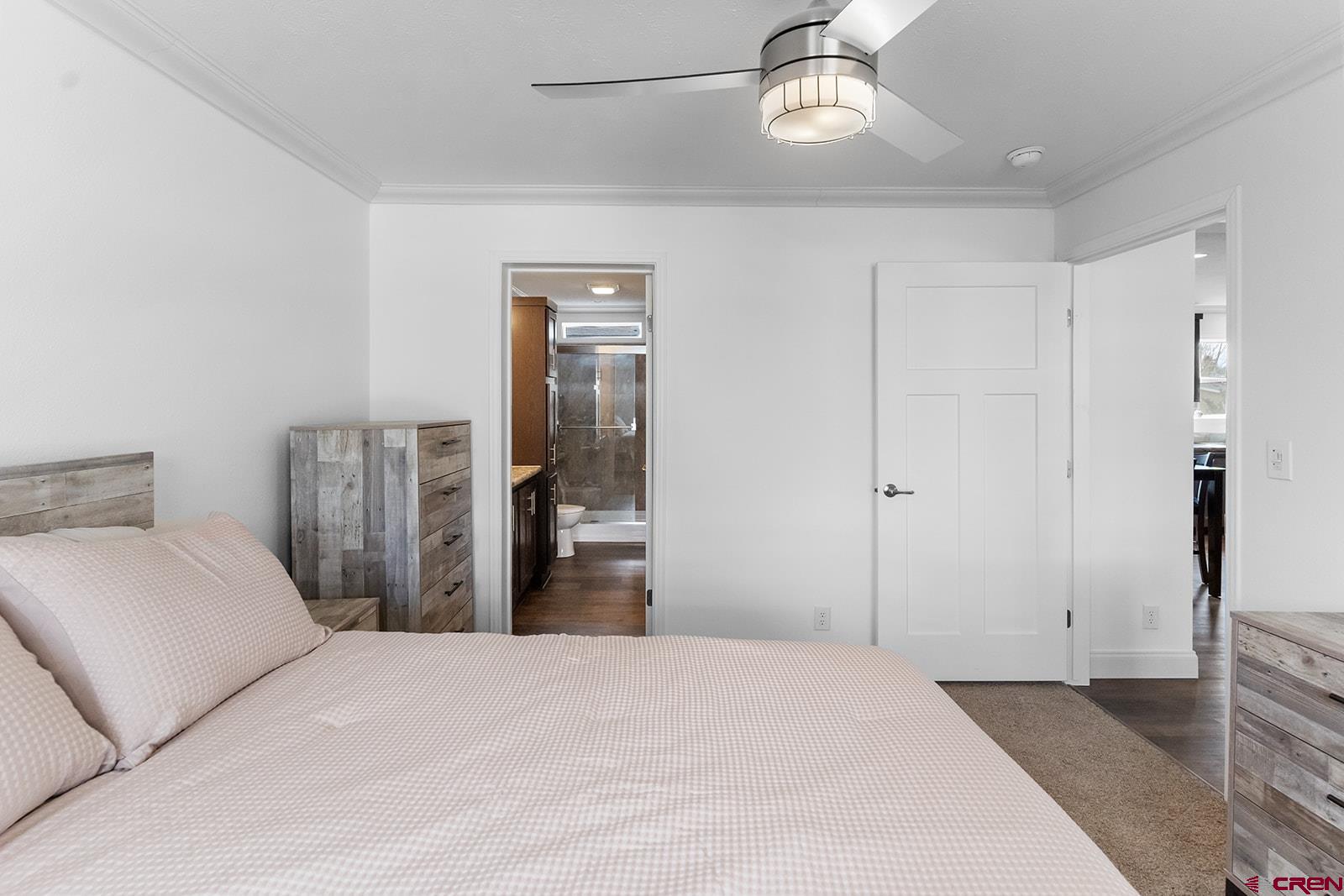 901 6530 Road, Unit 1504 Montrose, CO 81401 - Photo 17 of 25 a bedroom with a bed and a chandelier