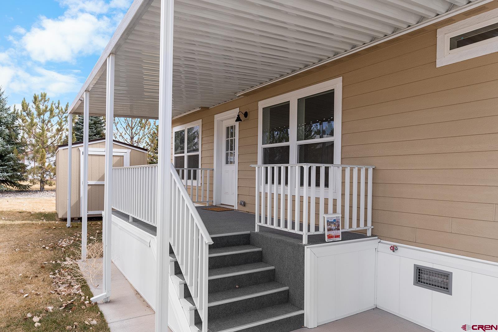 901 6530 Road, Unit 1504 Montrose, CO 81401 - Photo 3 of 25 a view of entryway with wooden stairs