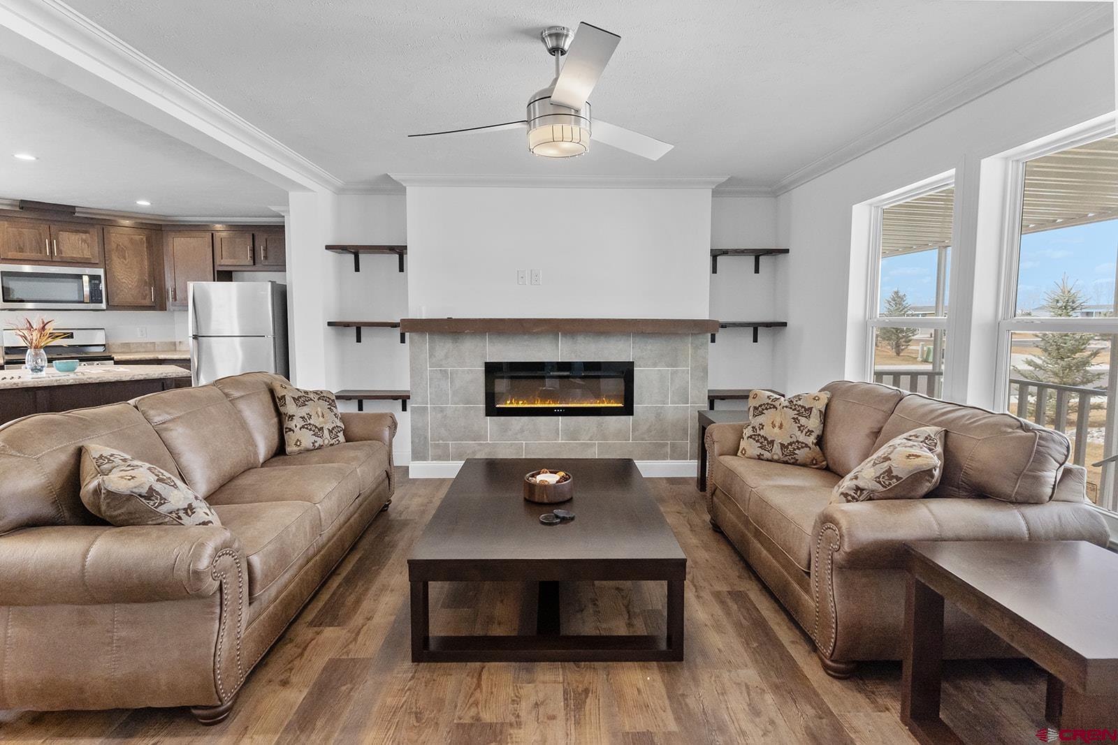 901 6530 Road, Unit 1504 Montrose, CO 81401 - Photo 6 of 25 a living room with furniture and a fireplace