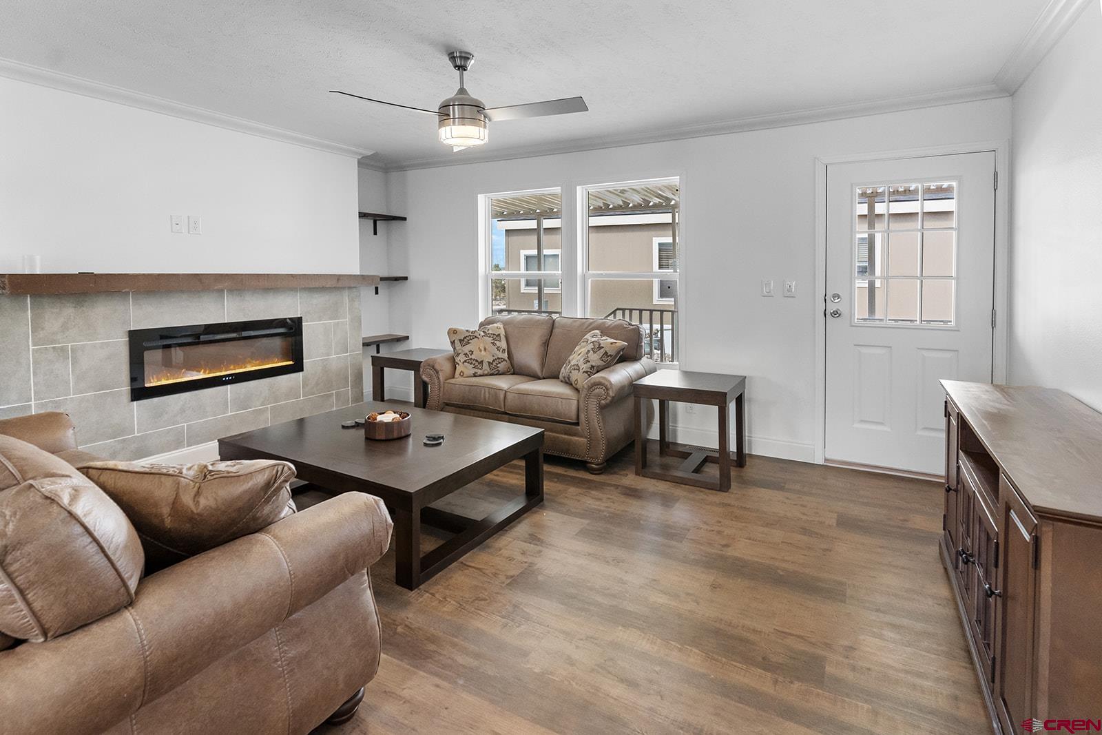 901 6530 Road, Unit 1504 Montrose, CO 81401 - Photo 7 of 25 a living room with furniture and a fireplace