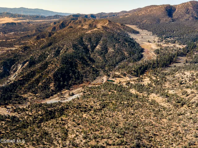 a view of mountain view with mountains in the background