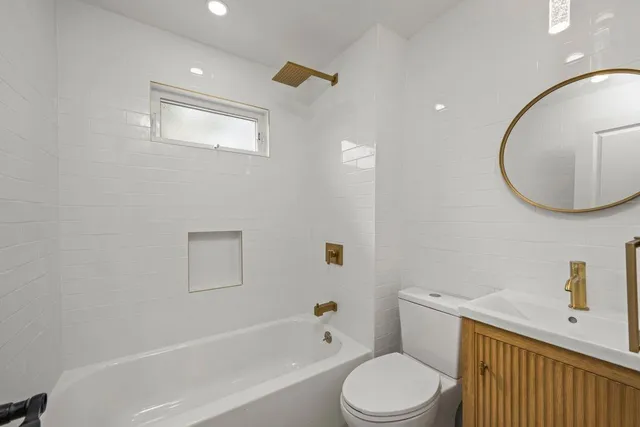 a bathroom with a toilet and a sink