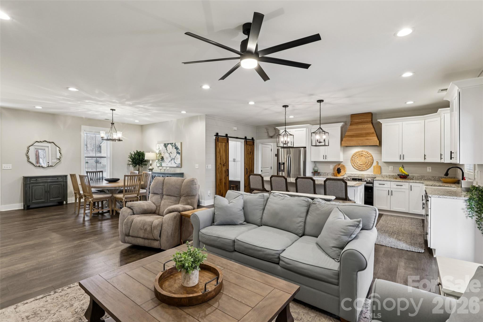 2807 Noritake Trail Albemarle, NC 28001 - Photo 12 of 45 a living room with furniture kitchen view and a chandelier