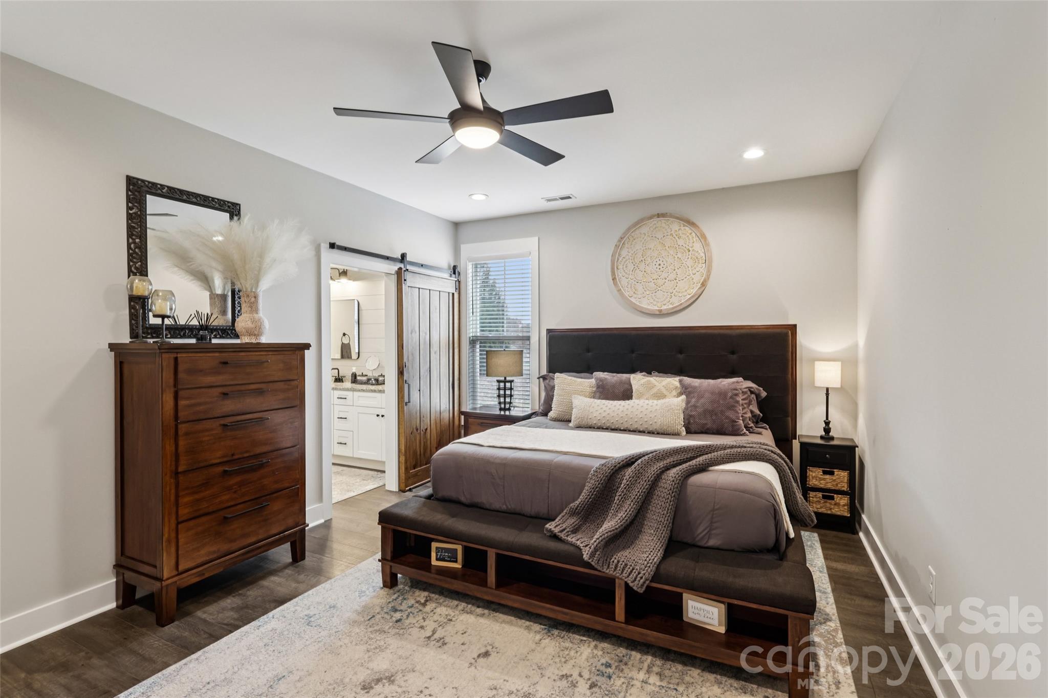 2807 Noritake Trail Albemarle, NC 28001 - Photo 24 of 45 a bedroom with a bed and a chandelier