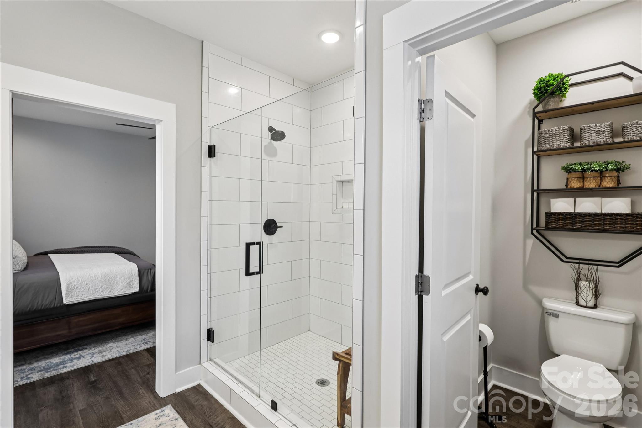 2807 Noritake Trail Albemarle, NC 28001 - Photo 27 of 45 a bathroom with a shower a toilet and a sink