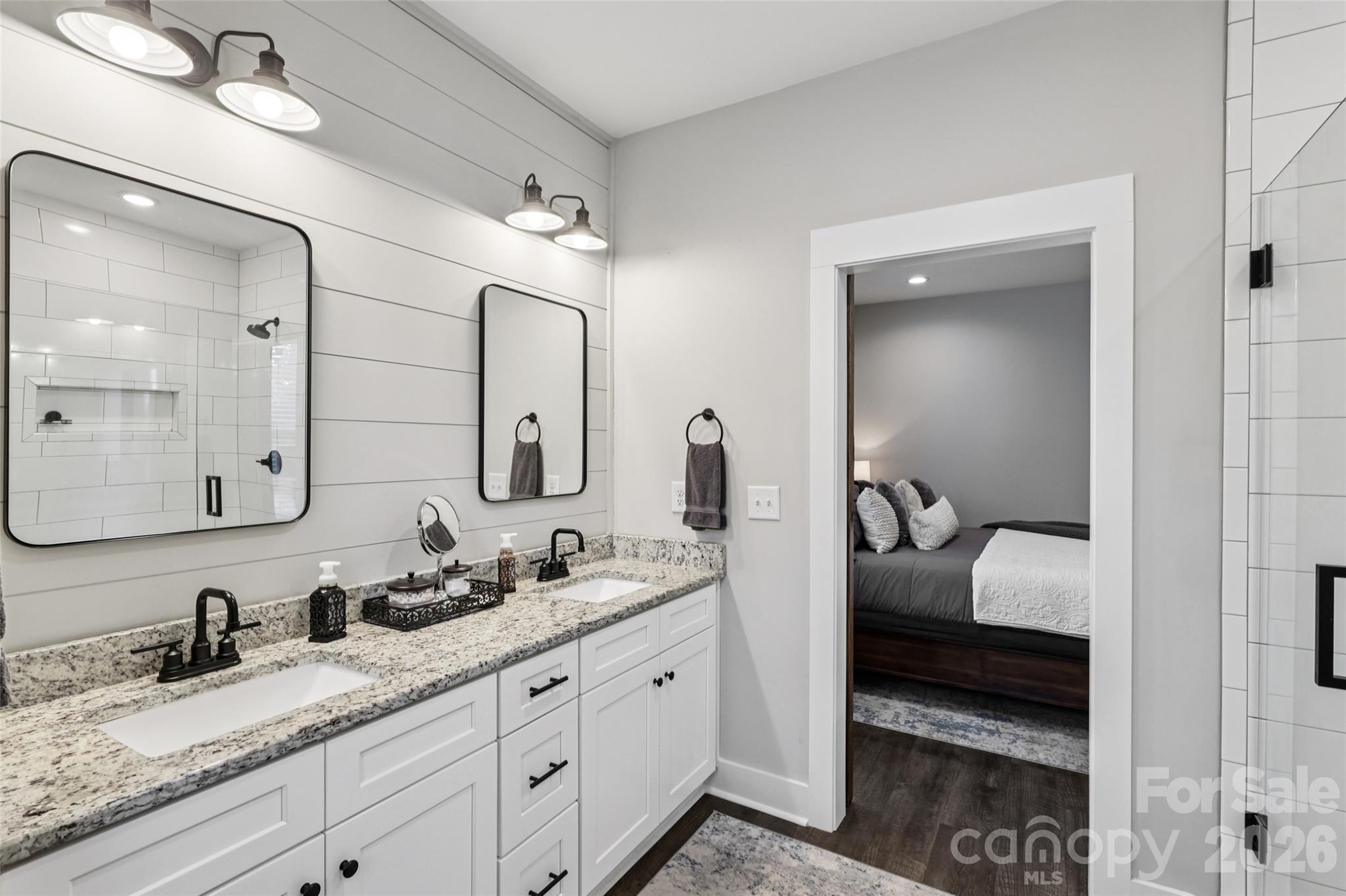 2807 Noritake Trail Albemarle, NC 28001 - Photo 29 of 45 a en suite bathroom with double sink and a mirror