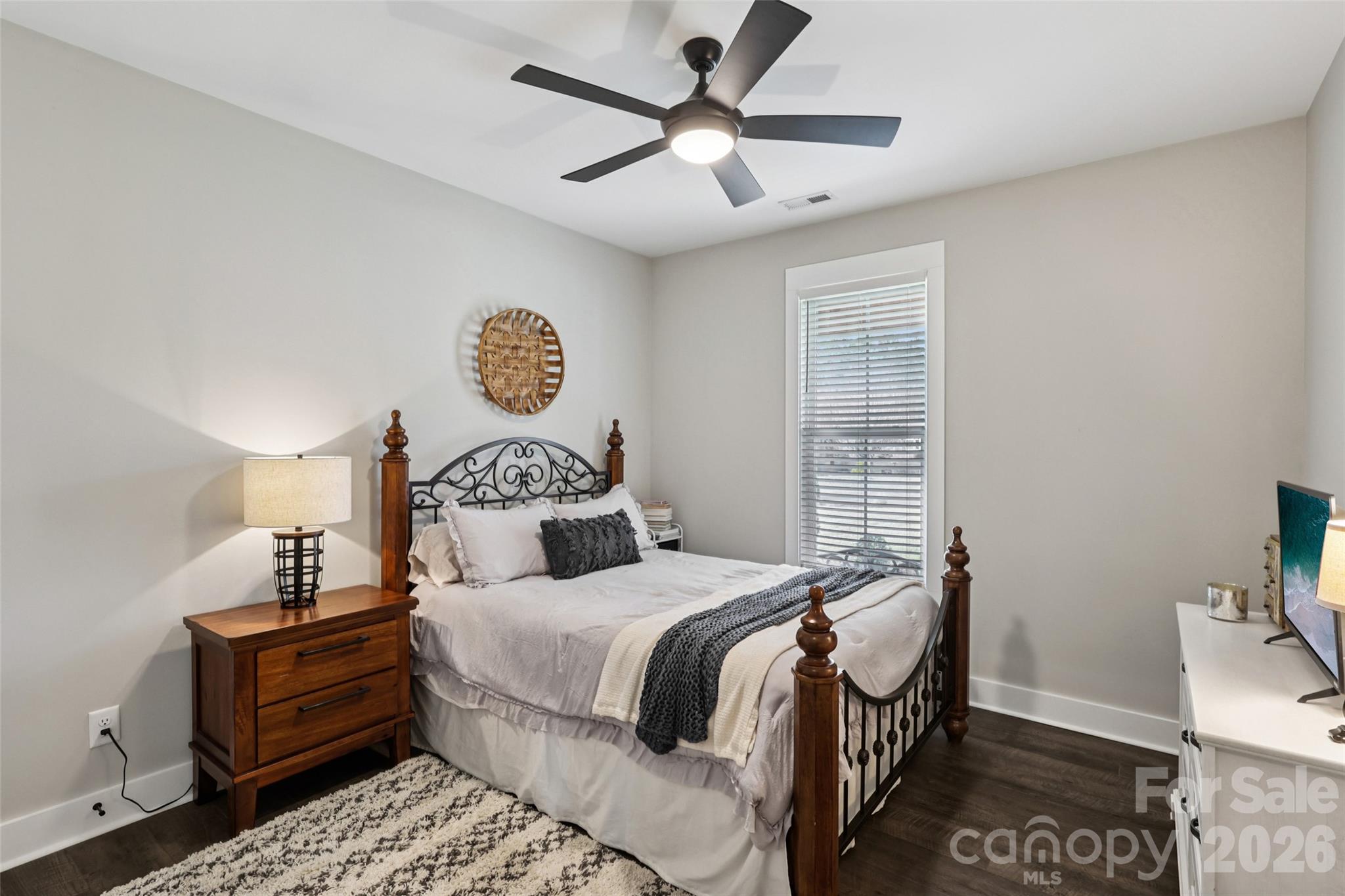 2807 Noritake Trail Albemarle, NC 28001 - Photo 31 of 45 a bedroom with a bed and wooden floor