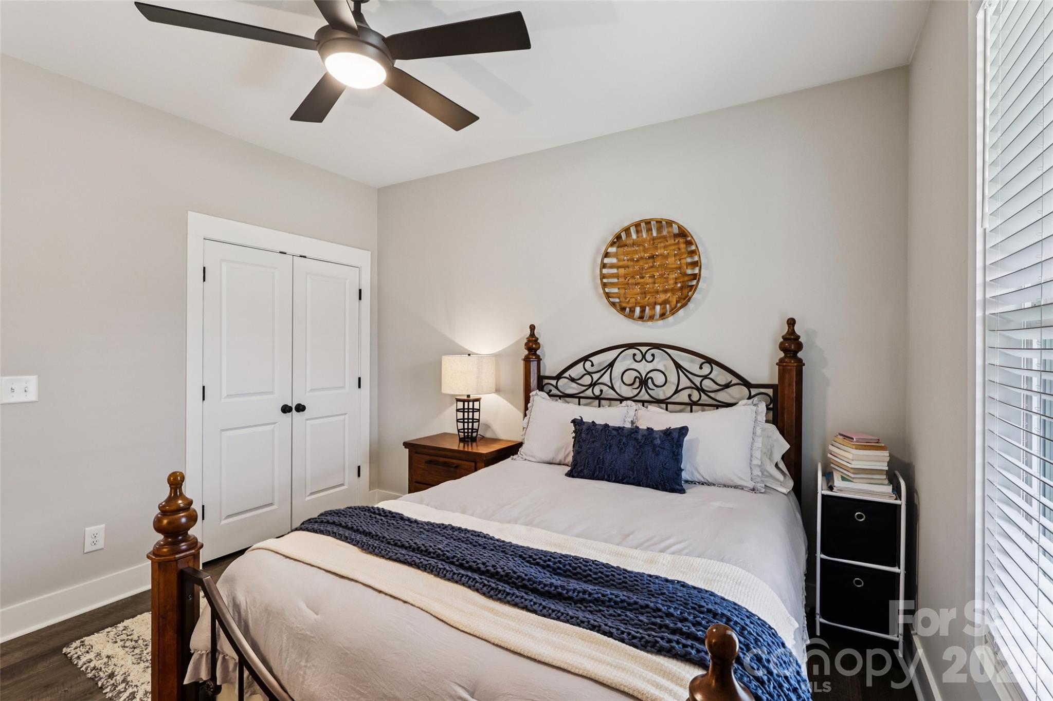 2807 Noritake Trail Albemarle, NC 28001 - Photo 32 of 45 a bedroom with a bed and a chandelier