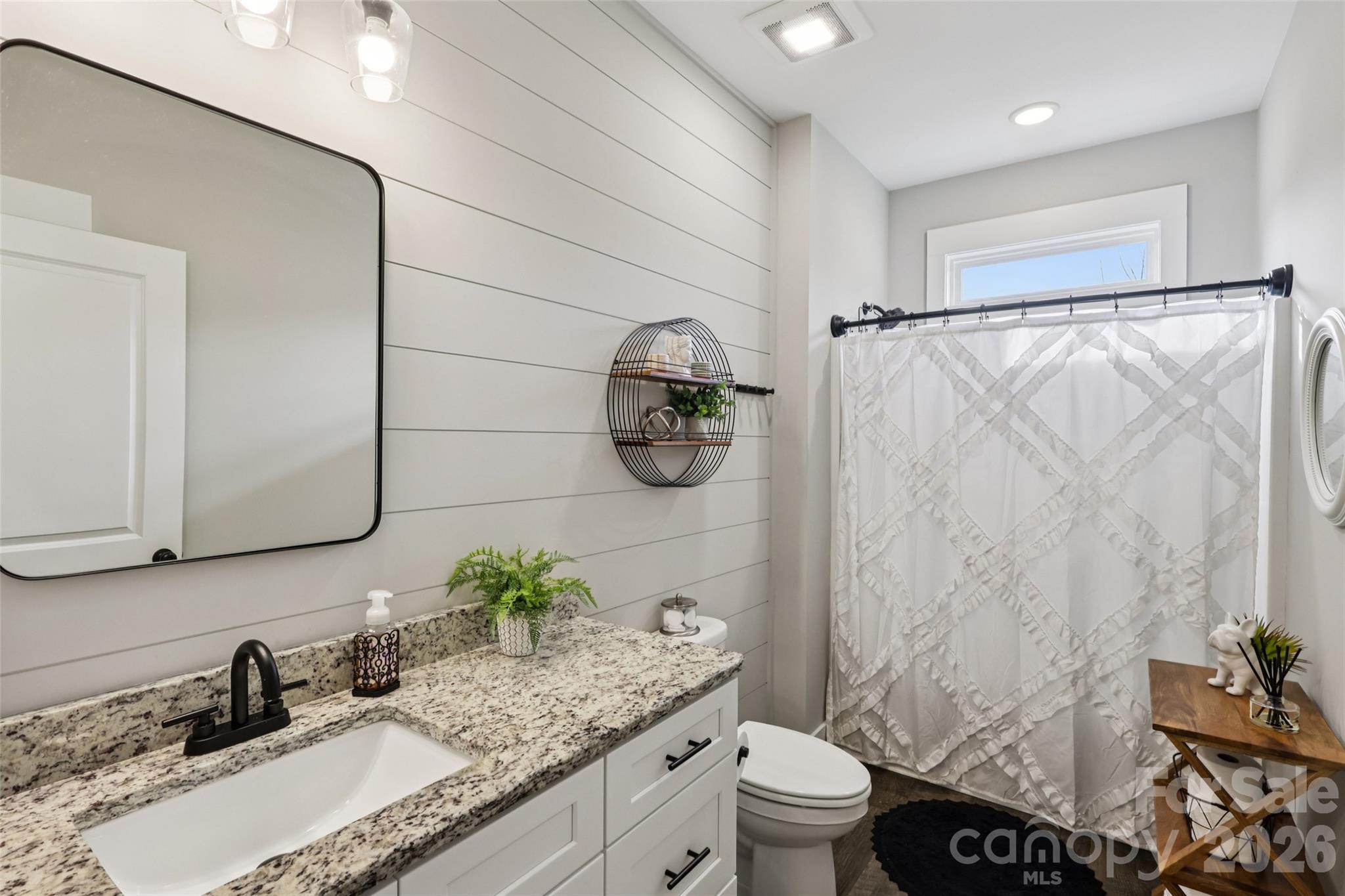 2807 Noritake Trail Albemarle, NC 28001 - Photo 35 of 45 a bathroom with a granite countertop sink and a mirror