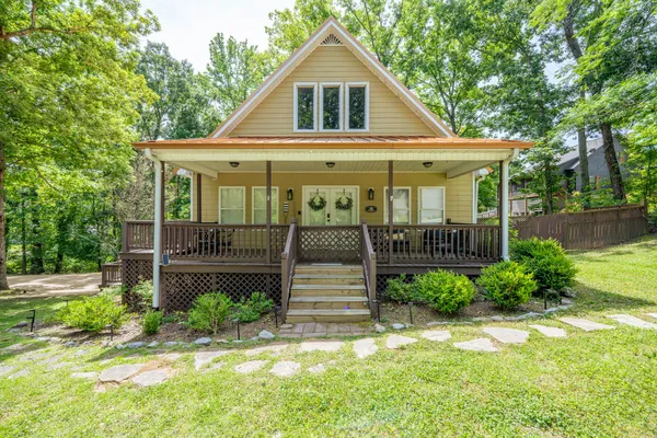 a front view of a house with garden