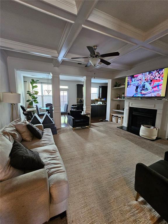 5747 Radford Loop Fairburn, GA 30213 - Photo 7 of 36 a living room with furniture a fireplace and a flat screen tv