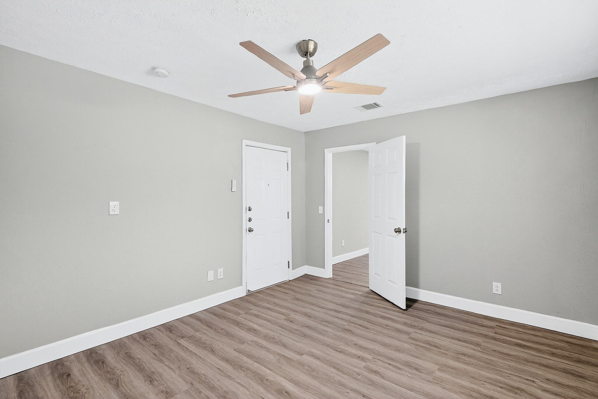 2510 Marble Falls Drive Spring, TX 77373 - Photo 17 of 26 an empty room with wooden floor and ceiling fan
