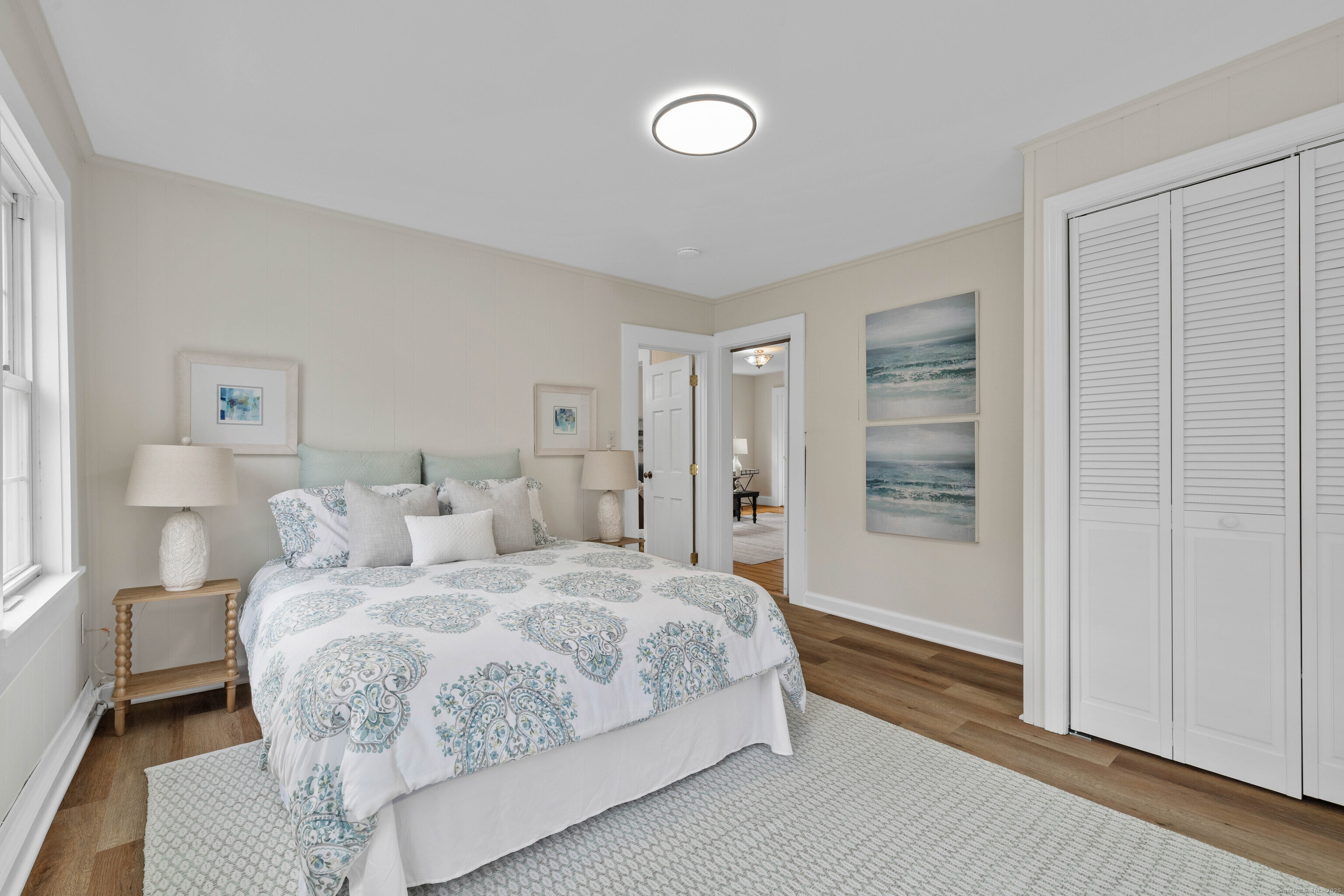 82 State Street Guilford, CT 06437 - Photo 13 of 40 a bedroom with a bed and a window