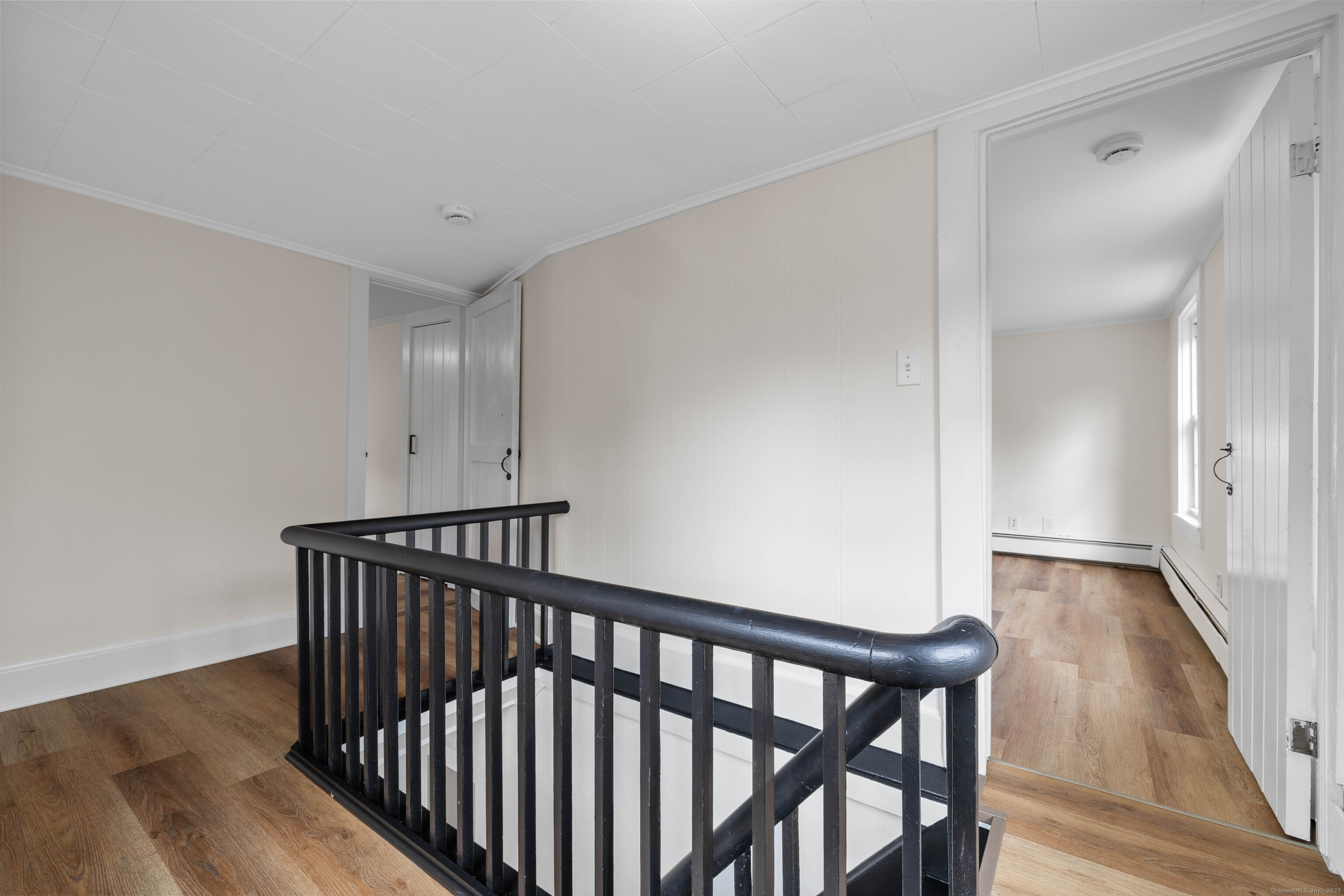 82 State Street Guilford, CT 06437 - Photo 14 of 40 a view of hallway with wooden floor
