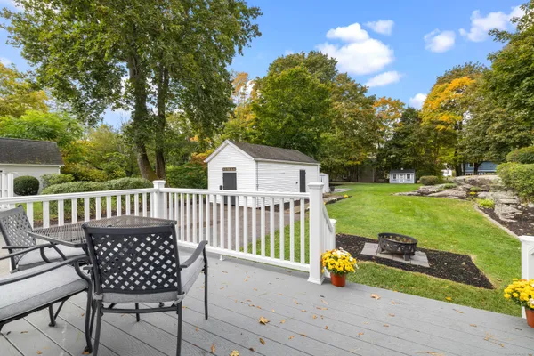 a view of a white house with a yard