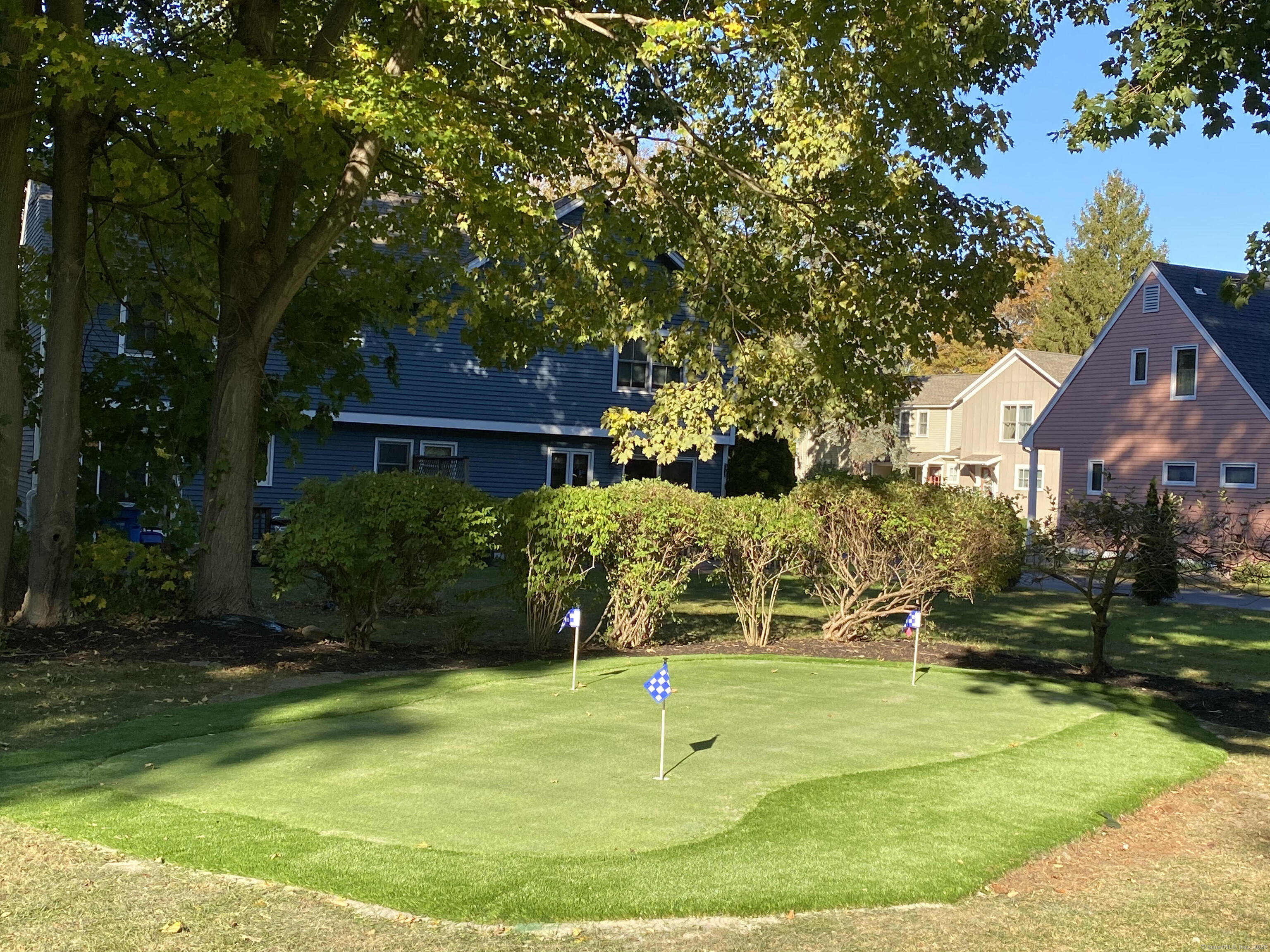 82 State Street Guilford, CT 06437 - Photo 33 of 40 a view of a playground with a patio