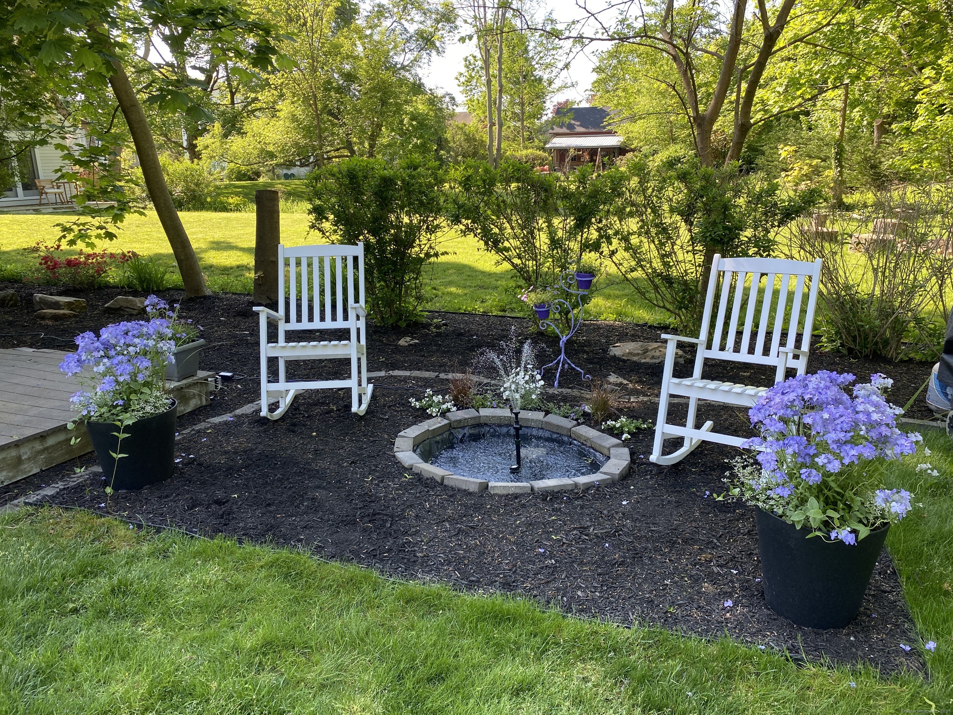 82 State Street Guilford, CT 06437 - Photo 34 of 40 a garden view with a seating space