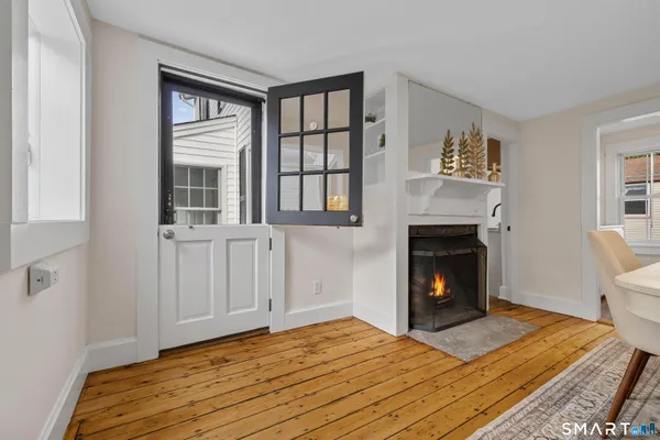 a bedroom with a bed and a fireplace