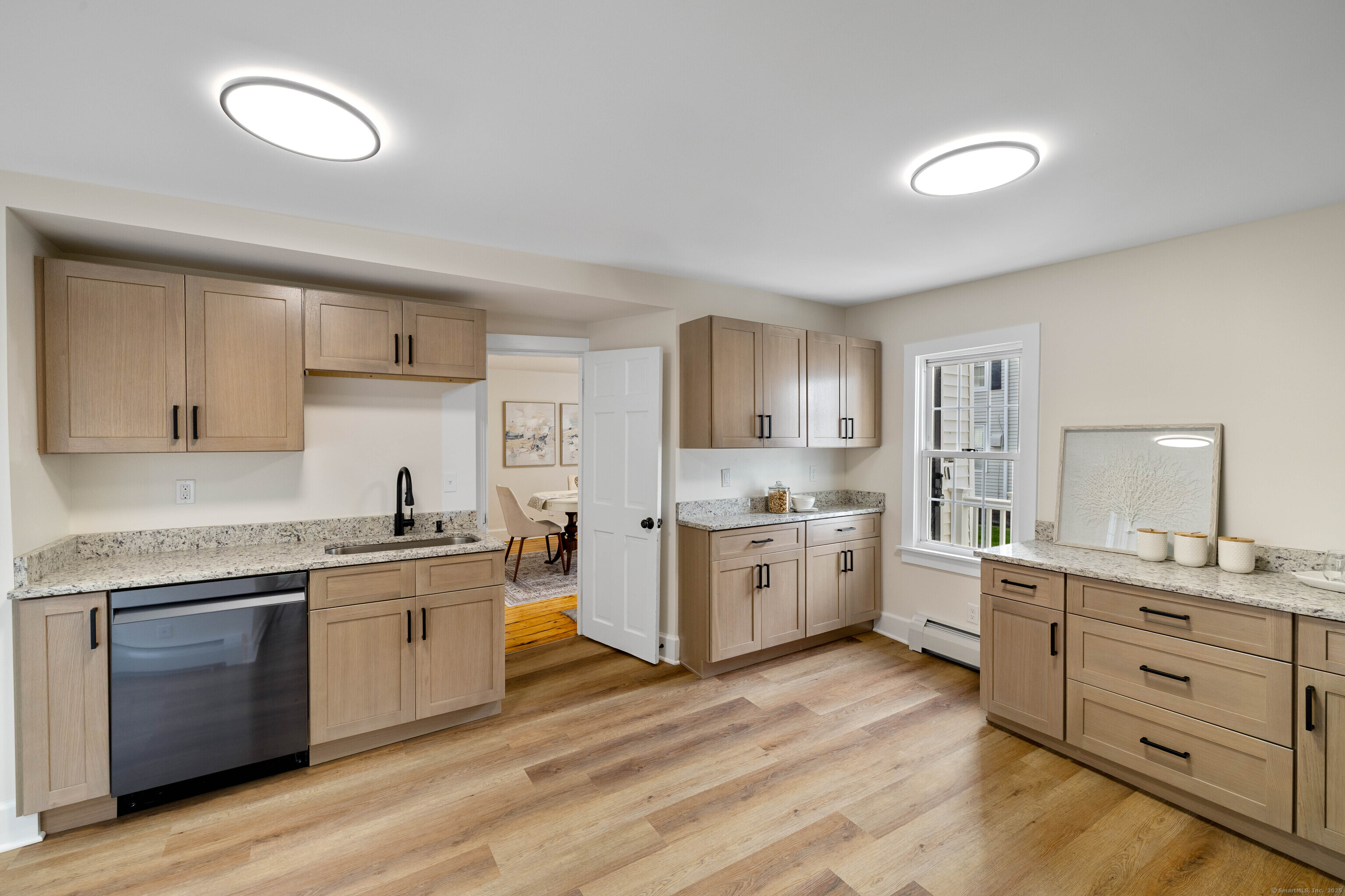 82 State Street Guilford, CT 06437 - Photo 8 of 40 a large kitchen with cabinets a sink and appliances