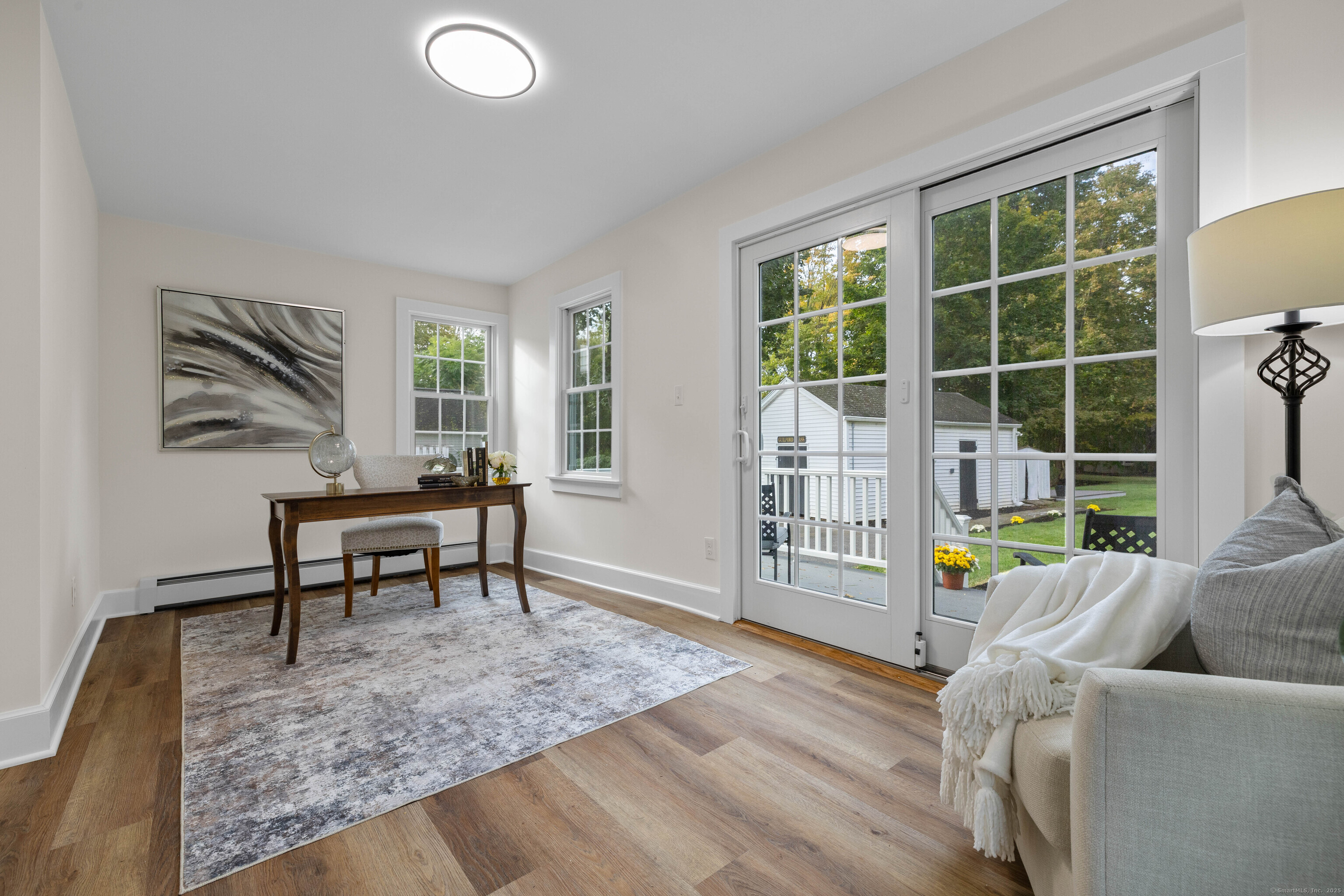 82 State Street Guilford, CT 06437 - Photo 9 of 40 a living room with furniture and a window