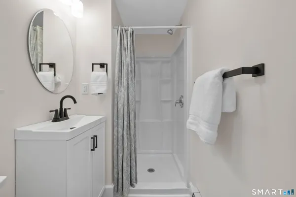 a bathroom with a sink and mirror
