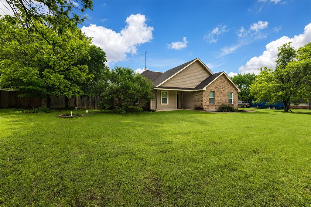 405 Kimbrough Road Azle, TX 76020 - Photo 2 of 39 a front view of house with yard and green space