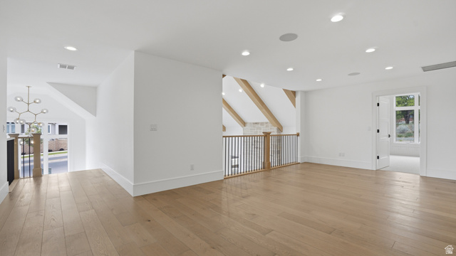 1682 North 1950 W Street, Unit 9 Provo, UT 84604 - Photo 55 of 84 Spacious upper-level area featuring wood-finish flooring, recessed lighting, and a modern chandelier