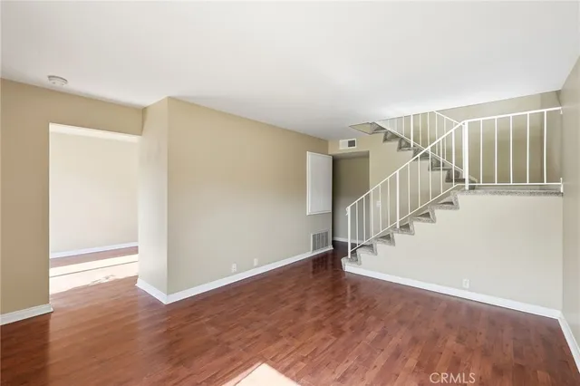 a view of entryway with wooden floor