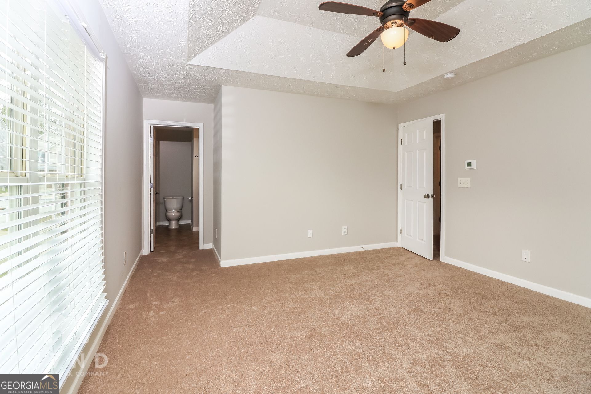3828 Leyland Drive Decatur, GA 30034 - Photo 14 of 26 a view of a room with a ceiling fan and a window