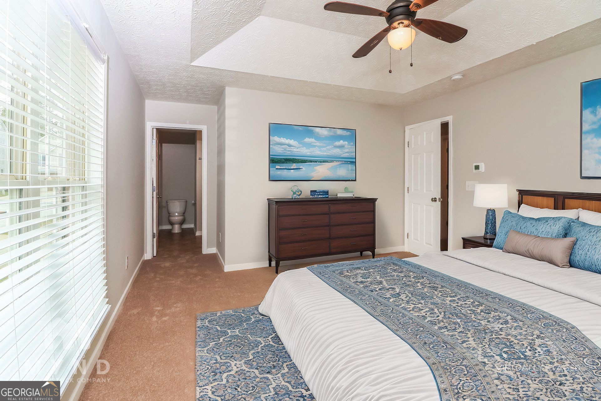 3828 Leyland Drive Decatur, GA 30034 - Photo 15 of 26 a bedroom with a bed and a chandelier