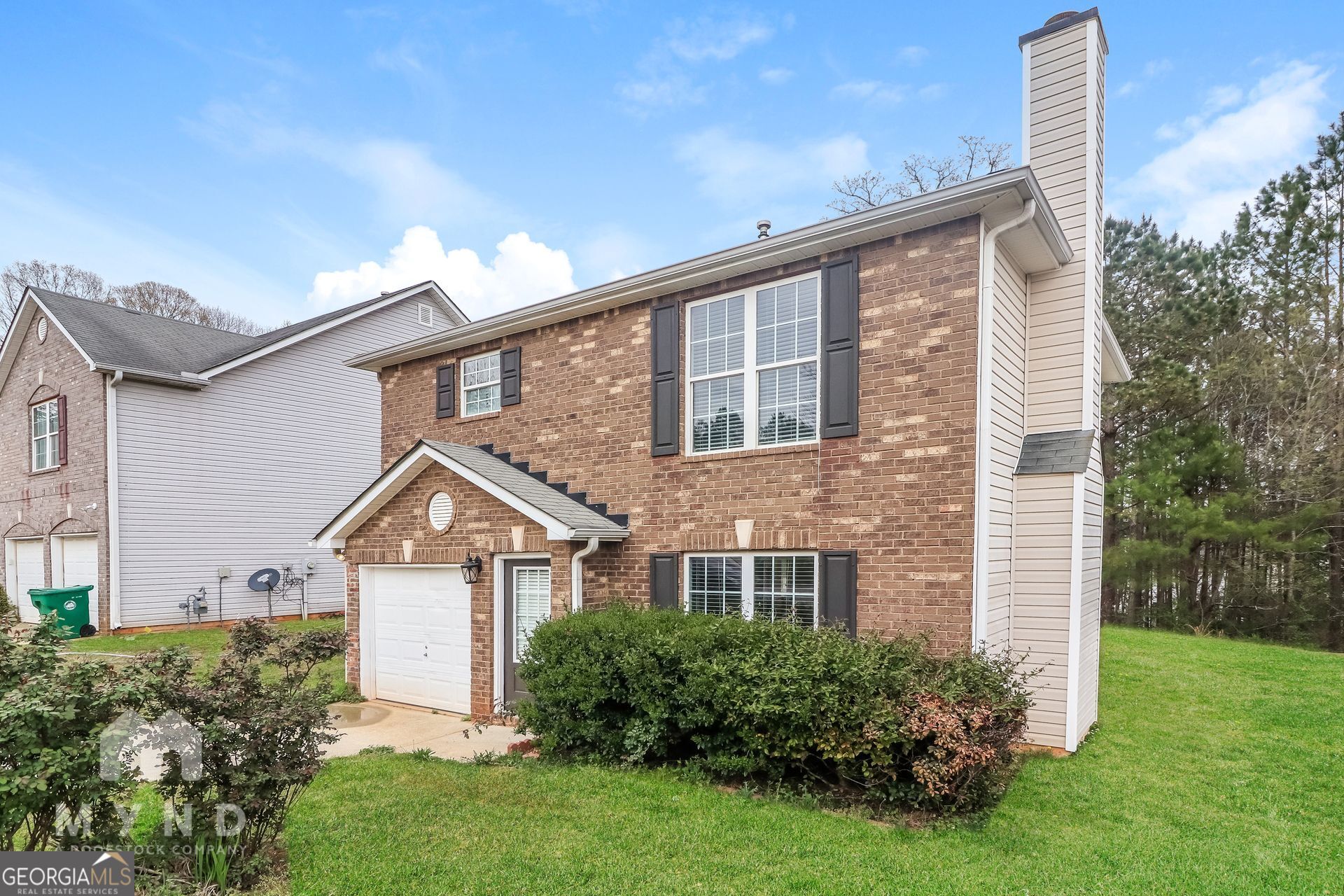 3828 Leyland Drive Decatur, GA 30034 - Photo 22 of 26 a front view of a house with a yard and trees