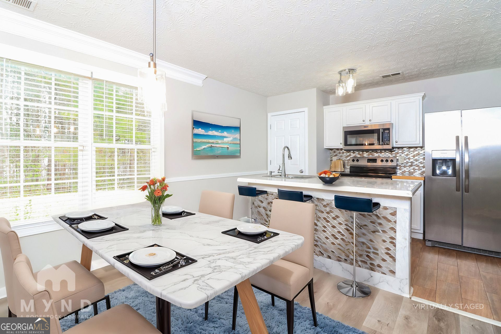 3828 Leyland Drive Decatur, GA 30034 - Photo 3 of 26 a kitchen with a refrigerator a stove a sink dishwasher a dining table and chairs with wooden floor