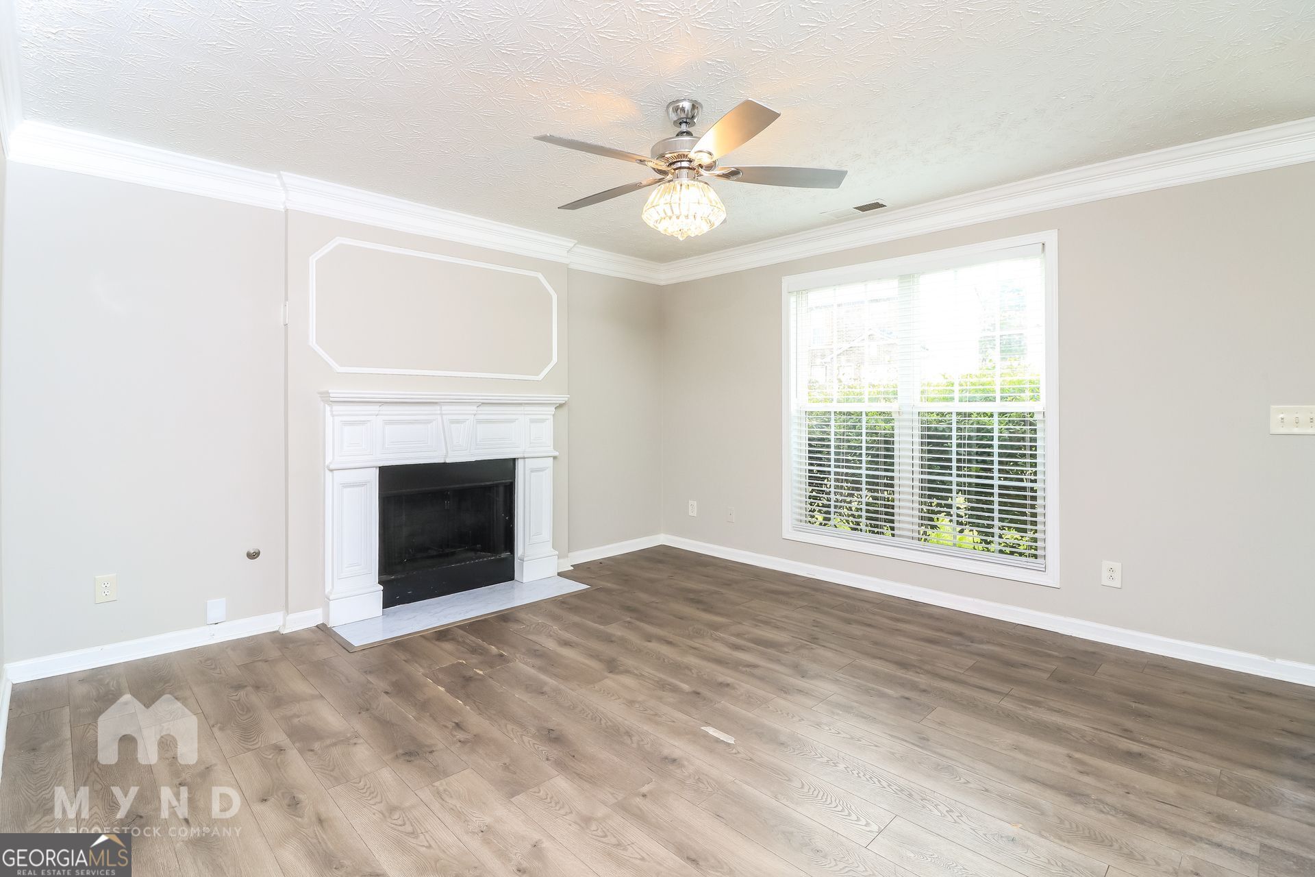 3828 Leyland Drive Decatur, GA 30034 - Photo 7 of 26 a view of an empty room with a fireplace and a window
