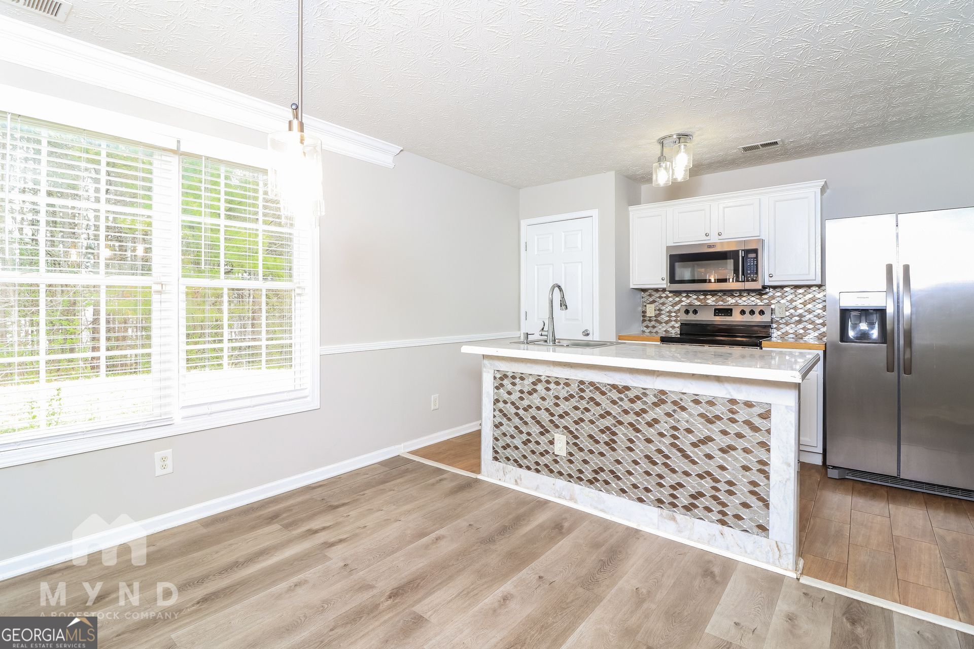 3828 Leyland Drive Decatur, GA 30034 - Photo 8 of 26 a kitchen with stainless steel appliances a refrigerator sink and microwave