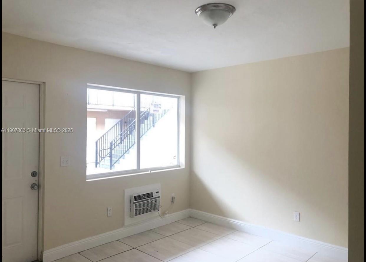 1940 Washington Avenue, Unit 15 Opa-Locka, FL 33054 - Photo 15 of 17 a view of an empty room with a window