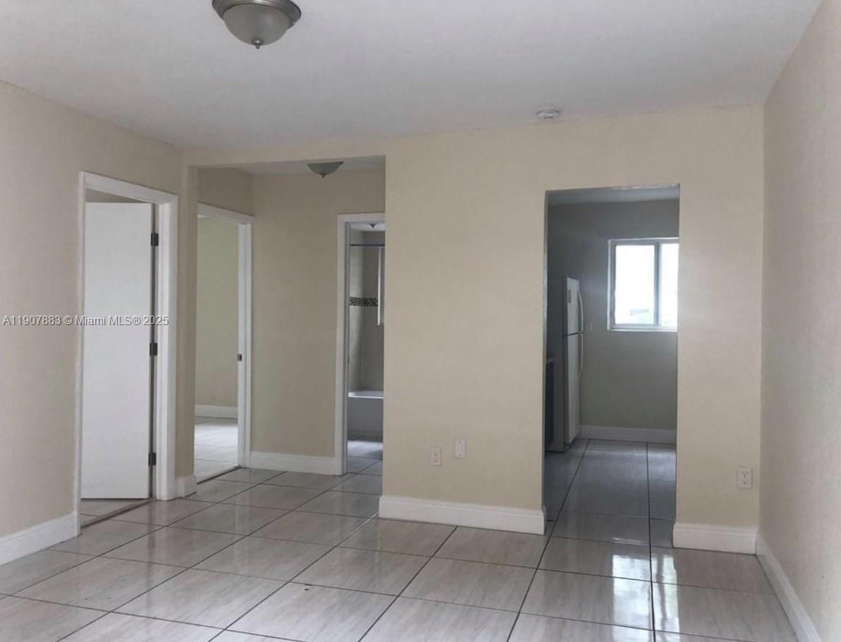 1940 Washington Avenue, Unit 15 Opa-Locka, FL 33054 - Photo 2 of 17 a view of an entryway and a hallway