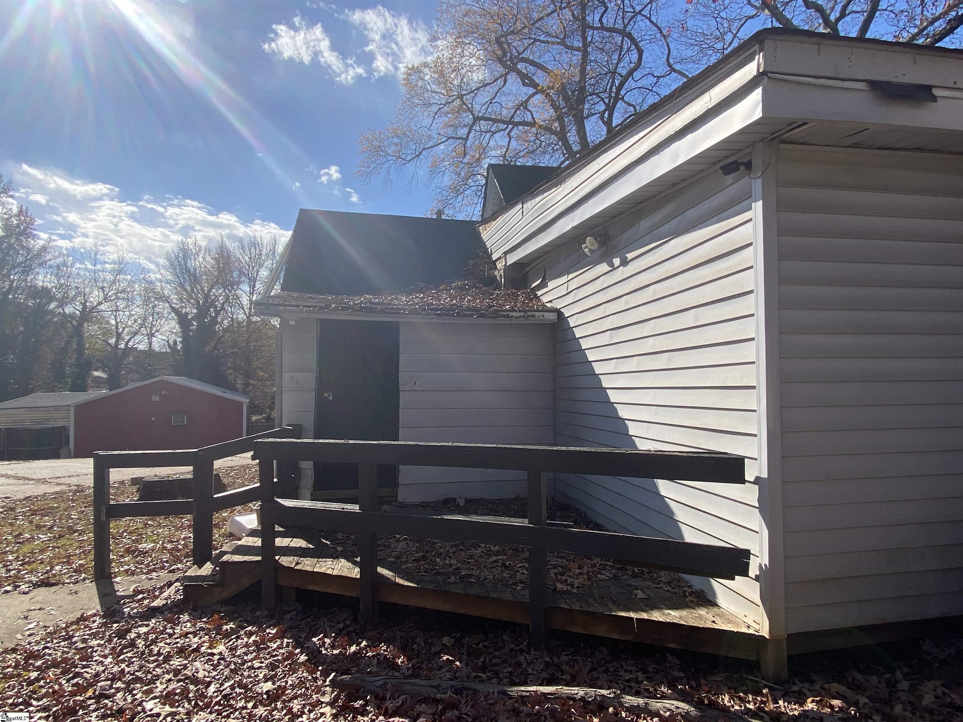 409 Easley Bridge Road Greenville, SC 29611 - Photo 5 of 28 The key unlocks the metal door off the back porch.