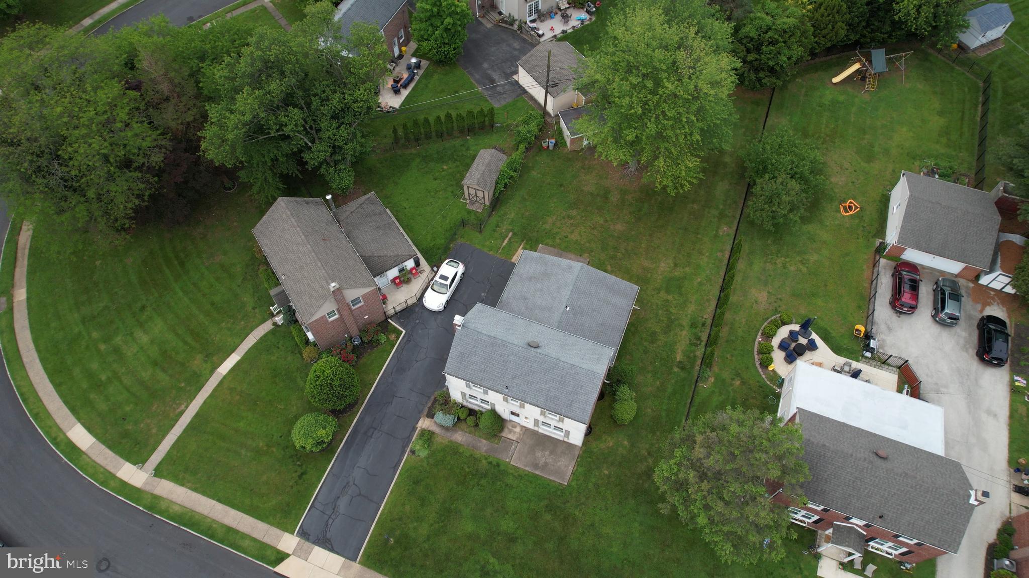 681 Dutton Circle Springfield, PA 19064 - Photo 2 of 45 an aerial view of a house with a garden and trees