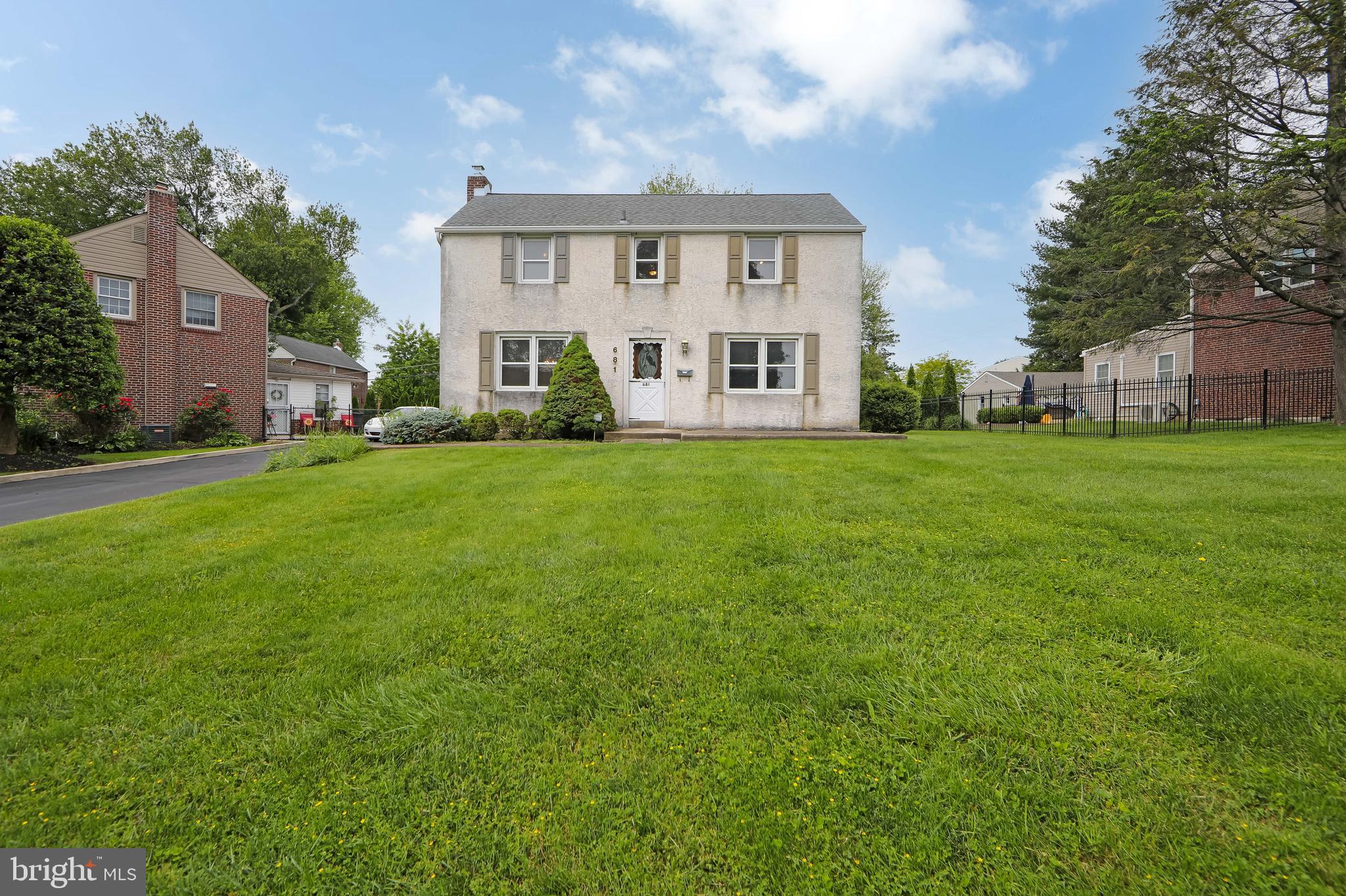681 Dutton Circle Springfield, PA 19064 - Photo 34 of 45 a view of a house with a big yard and large trees
