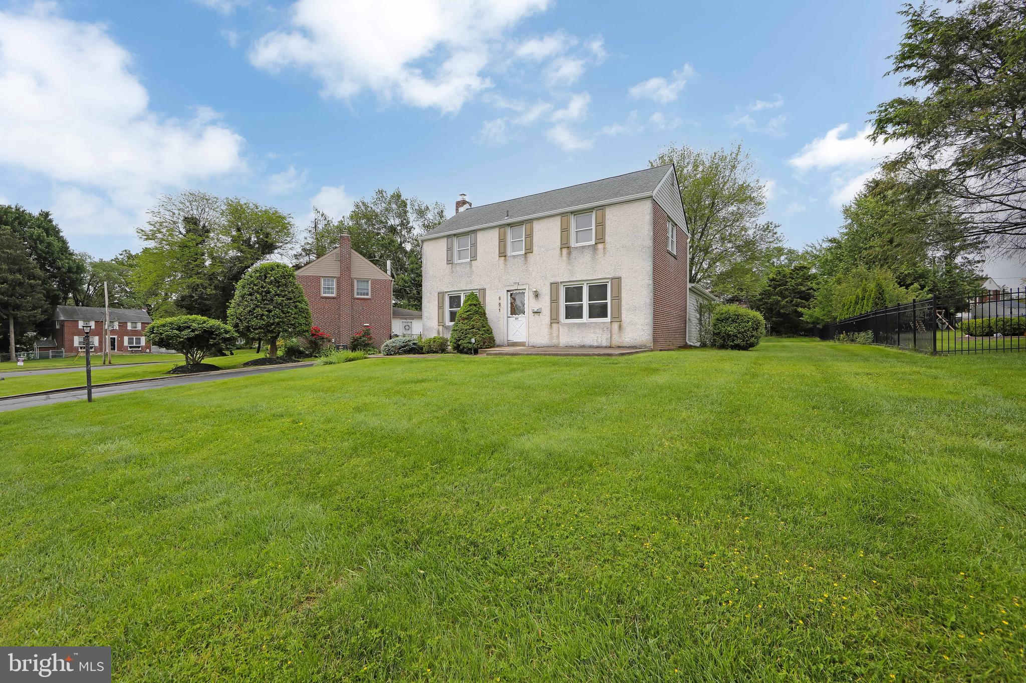 681 Dutton Circle Springfield, PA 19064 - Photo 35 of 45 a view of a house with a big yard and large trees