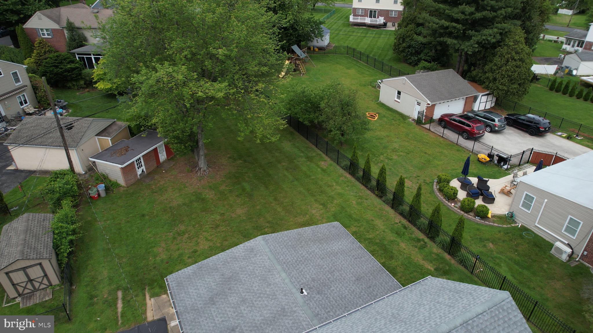 681 Dutton Circle Springfield, PA 19064 - Photo 5 of 45 an aerial view of a house with a garden and yard