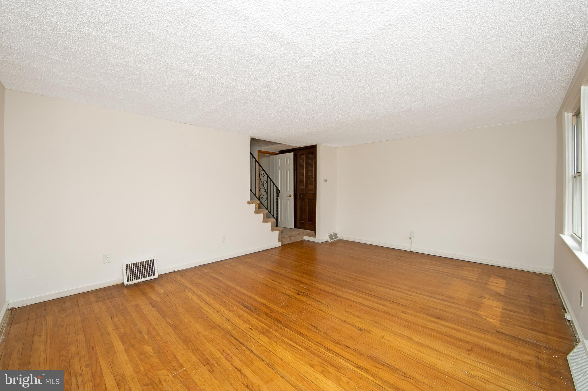 681 Dutton Circle Springfield, PA 19064 - Photo 6 of 45 a view of an empty room and wooden floor
