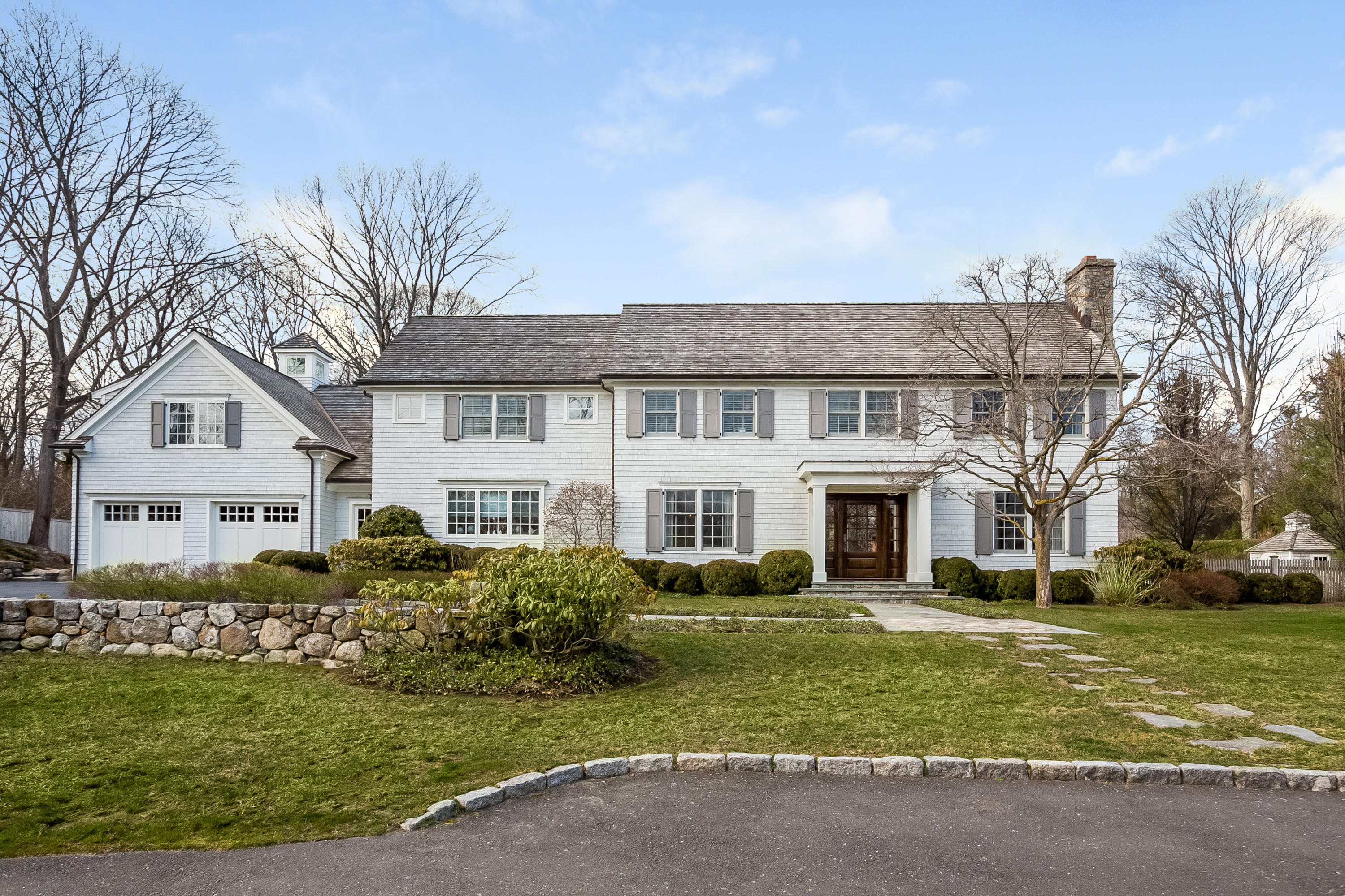 6 Davis Lane Darien, CT 06820 - Photo 1 of 49 a front view of a house with a garden