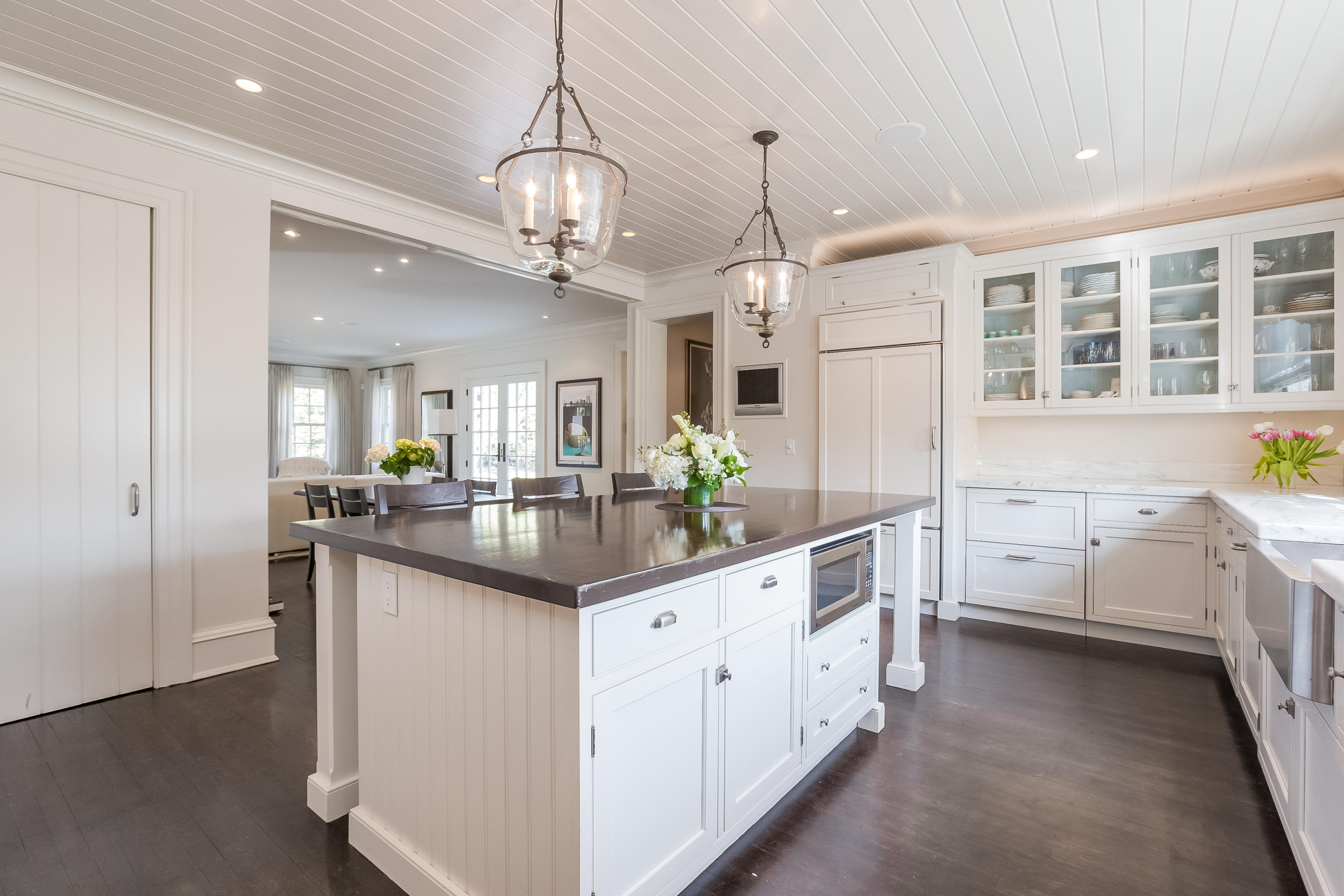 6 Davis Lane Darien, CT 06820 - Photo 14 of 49 a large white kitchen with granite countertop a white stove refrigerator and cabinets