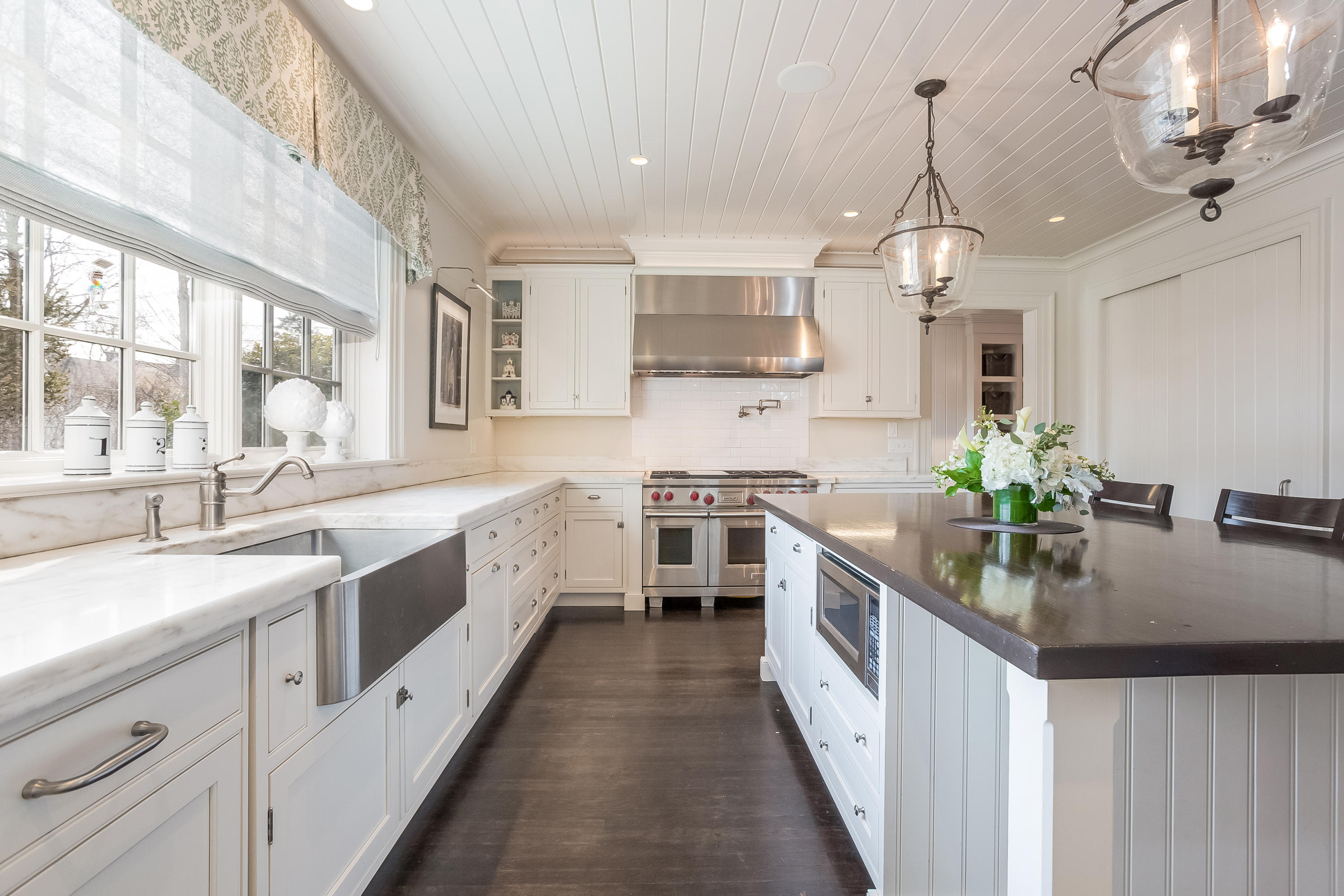 6 Davis Lane Darien, CT 06820 - Photo 15 of 49 a large kitchen with stainless steel appliances lots of counter space and wooden floor