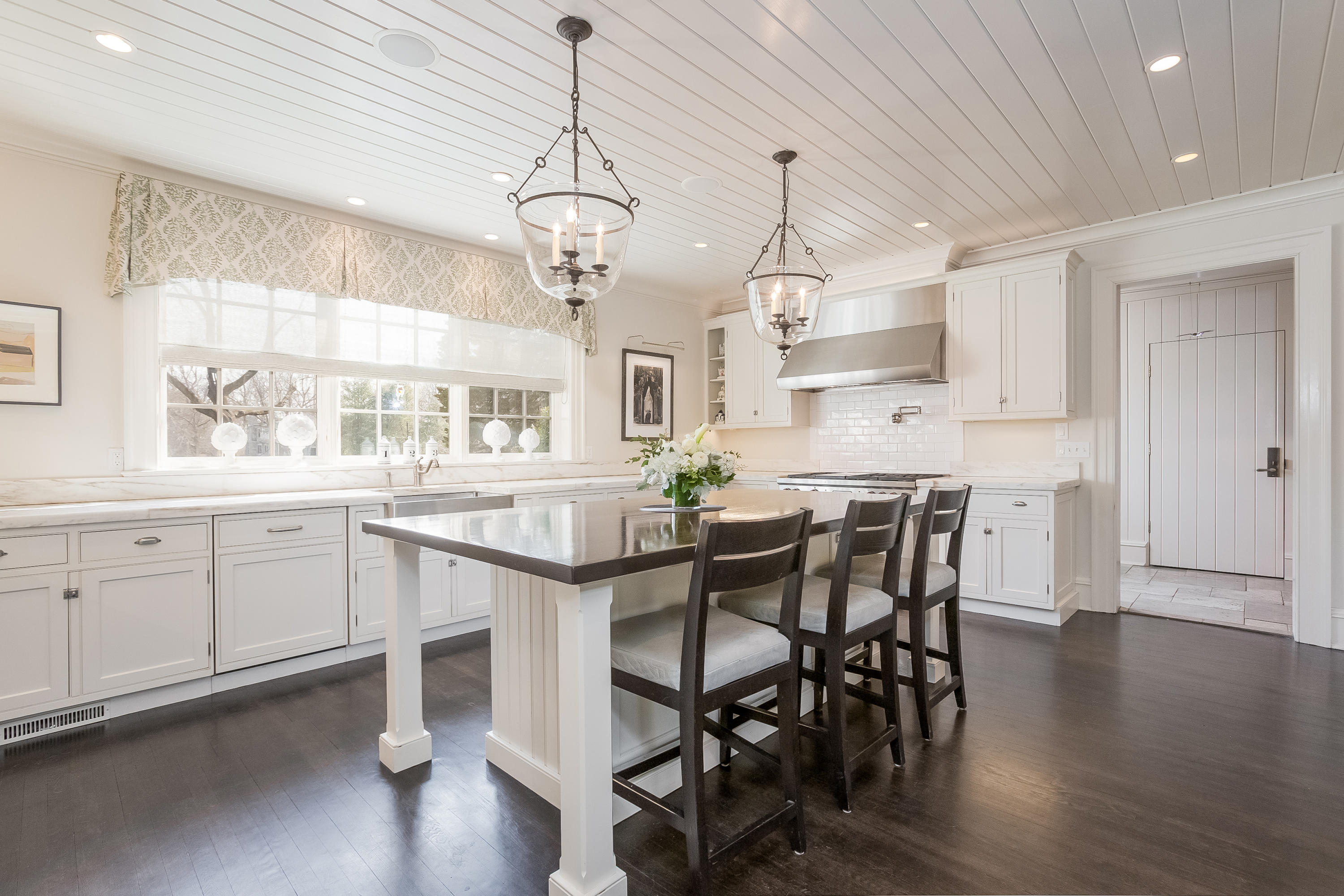 6 Davis Lane Darien, CT 06820 - Photo 16 of 49 a large kitchen with a table and chairs