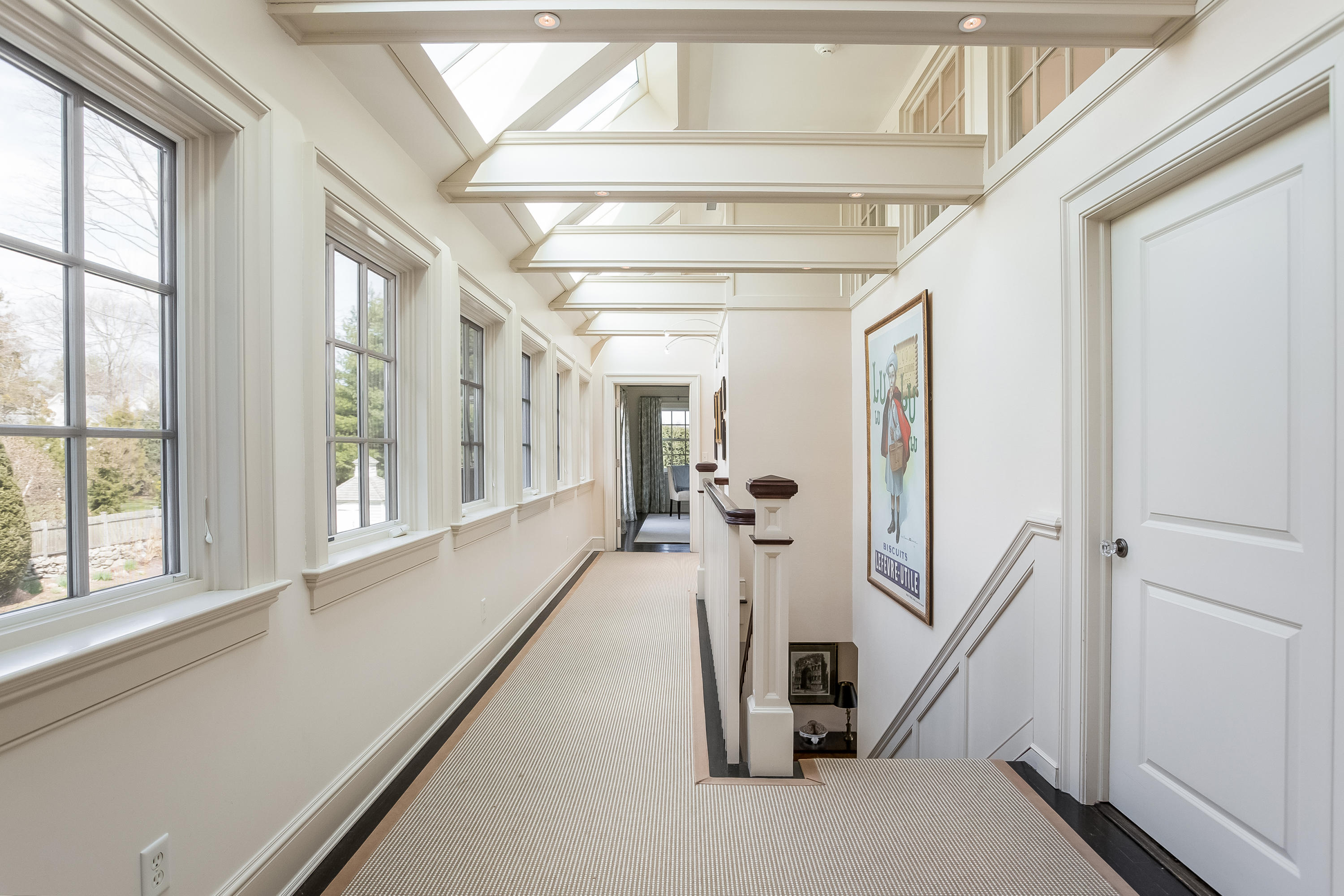 6 Davis Lane Darien, CT 06820 - Photo 22 of 49 a view of a hallway with a livingroom and furniture