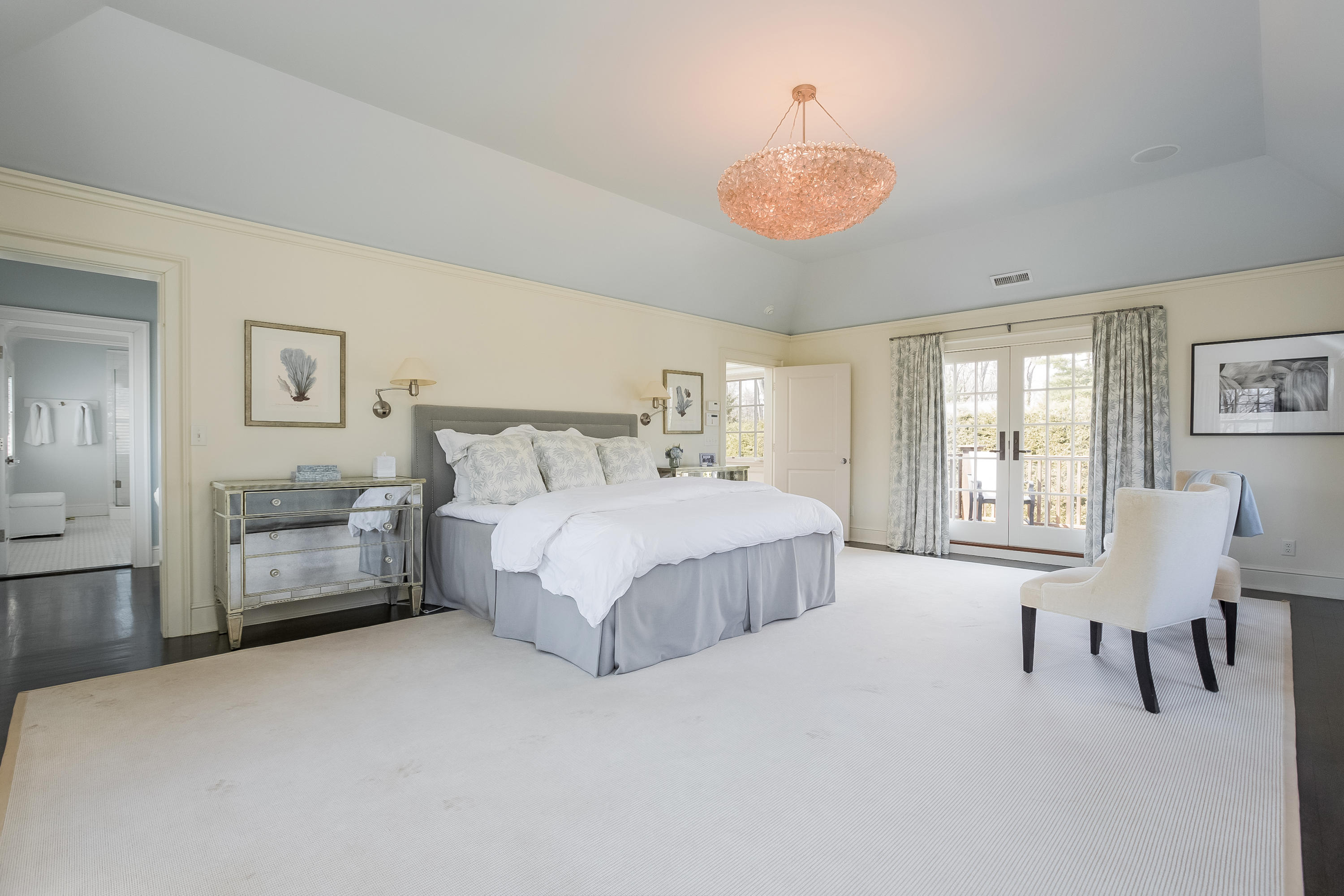 6 Davis Lane Darien, CT 06820 - Photo 23 of 49 a spacious bedroom with a bed chairs and window
